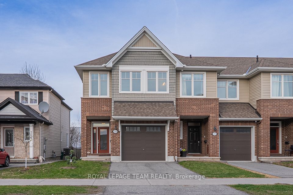 Welcome to this exceptional Tamarack Cambridge end-unit townhome in the sought-after Findlay Creek, one of Ottawas fastest-growing communities. Featuring a PRIVATE driveway and NO rear neighbors, this ENERGY STAR certified home is designed for modern living with a bright, functional layout and premium finishes. It offers 3 spacious bedrooms, 3 bathrooms, and a fully finished basement, making it ideal for families or investors. The exterior showcases a stylish brick and siding façade with an oversized garage. Inside, the main level features rich hardwood flooring and an open-concept design connecting the living, dining, and kitchen areas. The gourmet kitchen boasts a granite island, new stainless steel appliances, under-cabinet lighting, and a walk-in pantryperfect for daily meals or entertaining. The living room includes a Napoleon linear gas fireplace with changeable lighting and matching wall sconces, creating a cozy and sophisticated ambiance. The staircase landingunique to end unitsfeatures four large windows and a built-in niche for decor. Upstairs, the primary bedroom offers a luxury 4-piece ensuite and a spacious walk-in closet, while two additional bedrooms and a second-floor laundry room with a utility sink enhance convenience. The fully finished basement provides versatile space for a home theatre, gym, or playroom. Recent updates include new carpeting, vanity lighting, and faucets. Additional features include an HRV ventilation system and a tankless hot water heater. The private, fully fenced backyard offers a serene retreat with a childrens playhouse and garden beds. Located near parks, schools, shopping, public transit, and the future Leitrim LRT station, this move-in-ready home combines style, comfort, and convenience. Backing onto the plaza, everything you need steps away. Don't miss your chance to own this beautifully maintained property!