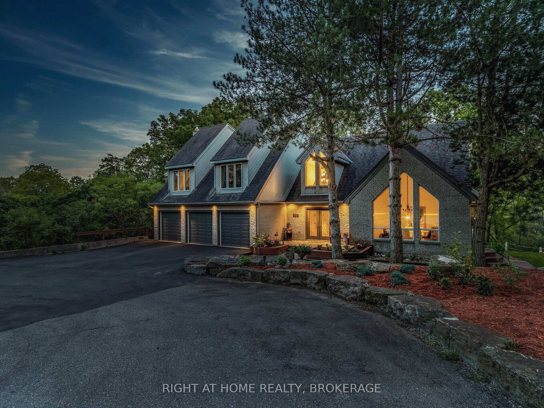 774 Old Dundas Road Hamilton, Ontario Discover a magnificent architectural masterpiece nestled on a private and tranquil two-acre property a true paradise of extraordinary. This exceptional residence boasts over 7,700 sq.ft of meticulously crafted living space, featuring a show-stopping indoor heated pool that will leave you in awe. As you step inside, you're greeted by soaring 23 ft cathedral ceilings on the main level, creating a sense of grandeur and space. The open-concept design seamlessly connects the living room and family room to the indoor pool area, offering an unparalleled blend of luxury and relaxation. A modern and spacious Scandinavian kitchen provides a perfect setting for family meals, with panoramic views of the surrounding nature. The lower level is an entertainer's dream, complete with direct access to the pool, wet bar, and a walkout to the backyard. The sprawling two-acre property spans across Old Dundas Rd and connects to Lower Lions Club Rd, offering additional parking for your RV and boat.