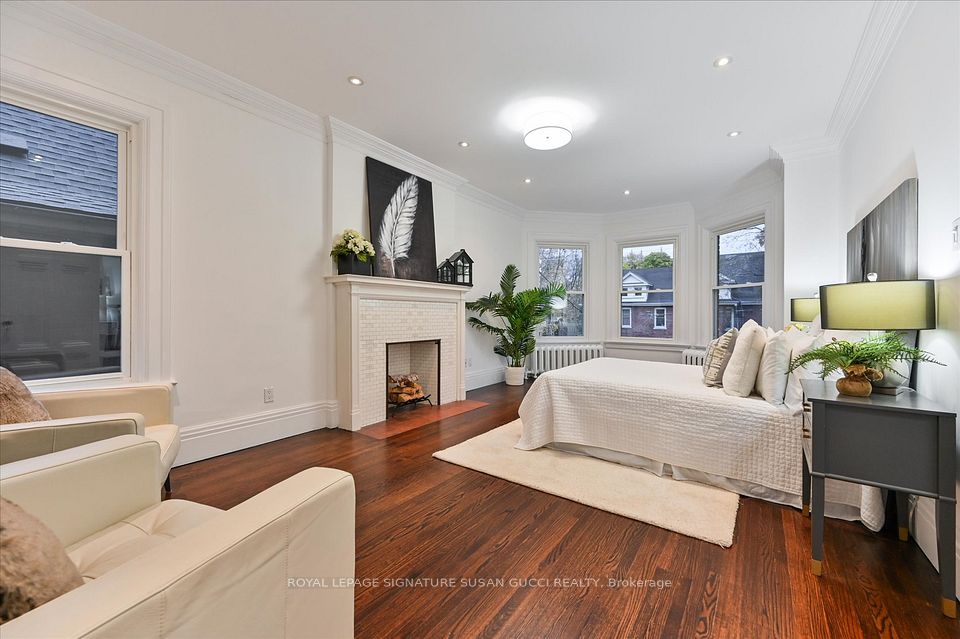 2nd level principal bedroom with fireplace