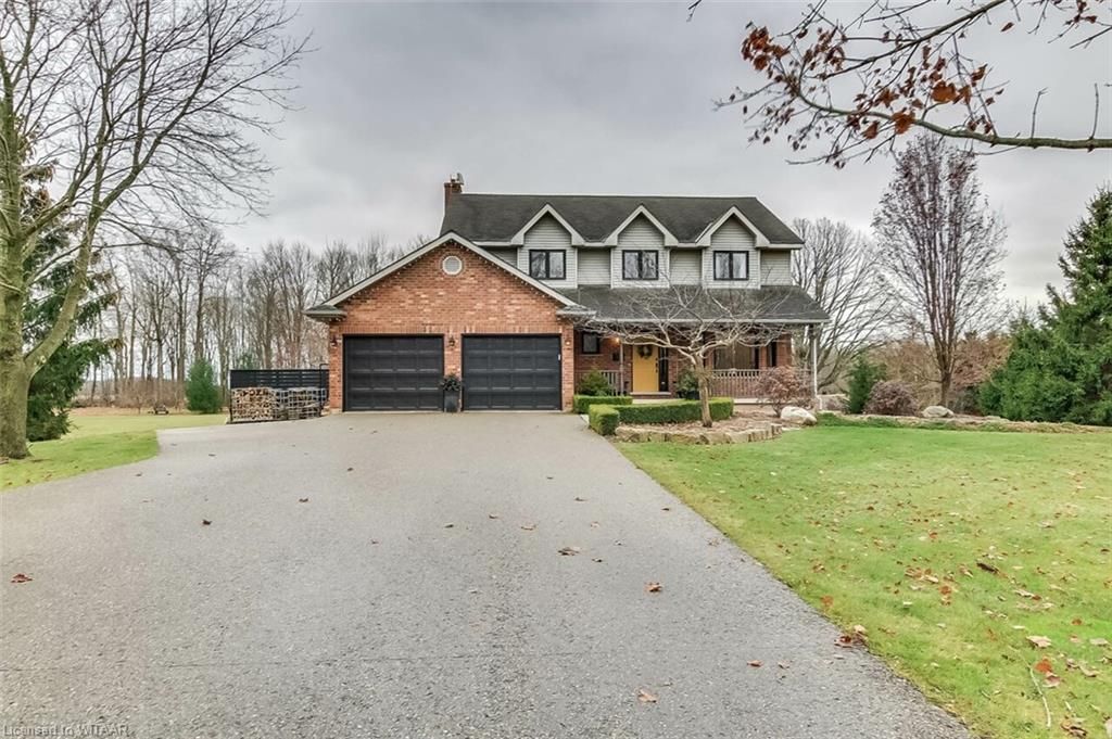 Front of property featuring a garage and a front yard