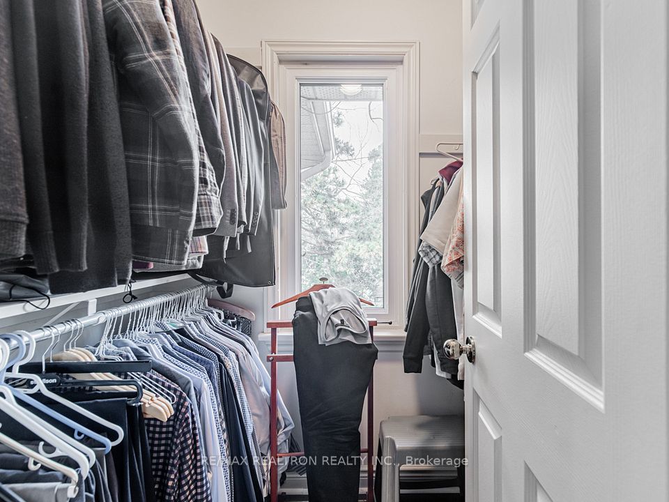 Primary Walk-in Closet (his)