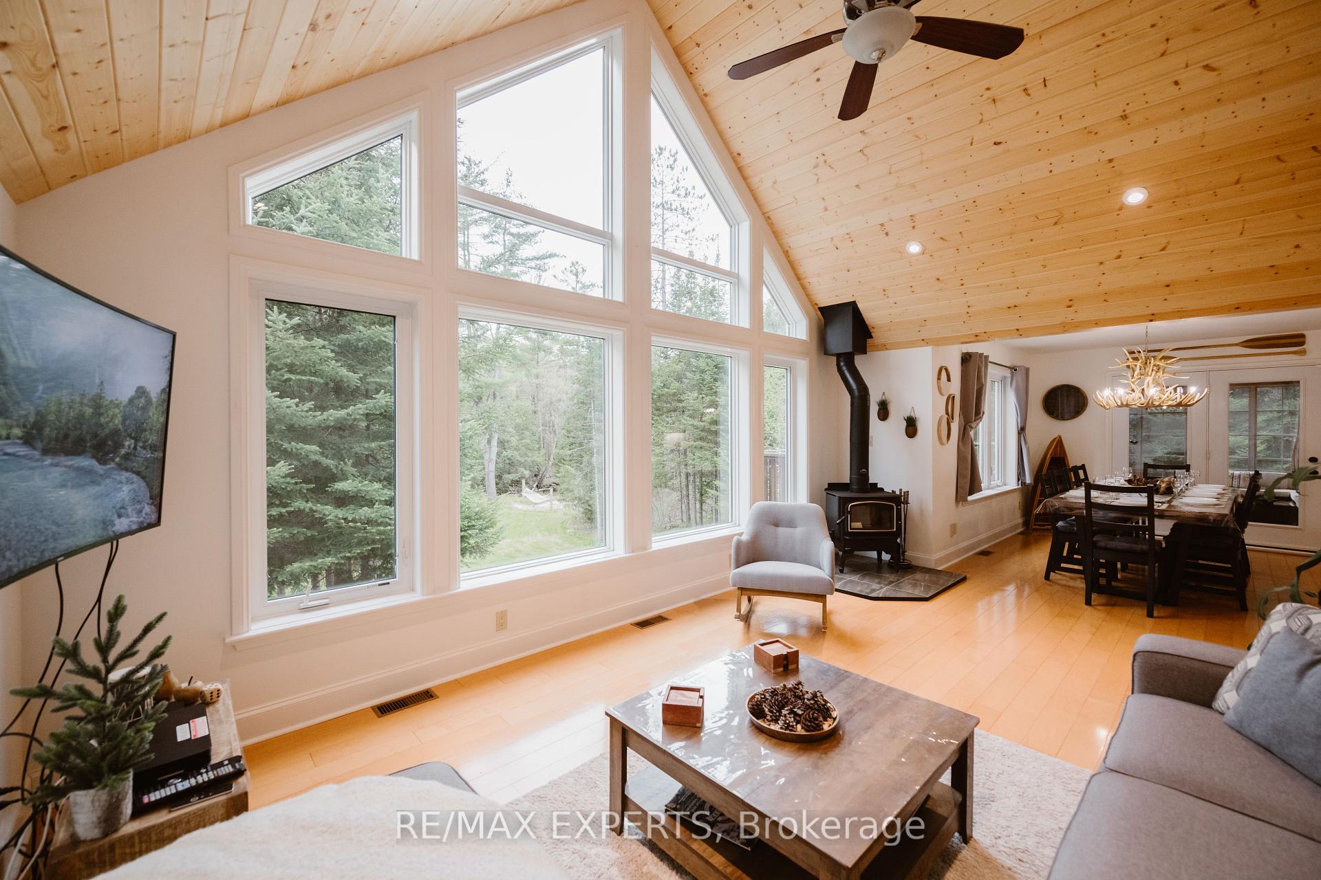Welcome to this high-performing short-term rental A Private, Year-Round Retreat on the Black River Tucked away on 2 acres of beautifully treed land, this 3+1 bedroom, 3-bathroom cottage offers exceptional privacy, peace, and flexibility. Located on a quiet municipal road approximately 30 minutes from downtown Bracebridge, its perfectly suited for year-round living, a serene getaway, or a high-performing short-term rental.Inside, the open-concept layout is filled with natural light. The main level features three bedrooms one ideal as a home office plus a fourth bedroom in the basement. Enjoy cozy evenings by the indoor wood stove and the convenience of three full bathrooms.Step outside to a large deck overlooking a tranquil natural setting. A single attached garage and a spacious driveway offer ample parking for guests. Theres also a fire pit for outdoor gatherings under the stars. With direct access to the Black River, you can paddle or launch a kayak right from your own backyard.High-speed Starlink internet is available, making remote work or streaming a breeze. This is true Muskoka living peaceful, private, and connected.Dont miss your chance to own a versatile and well-located cottage