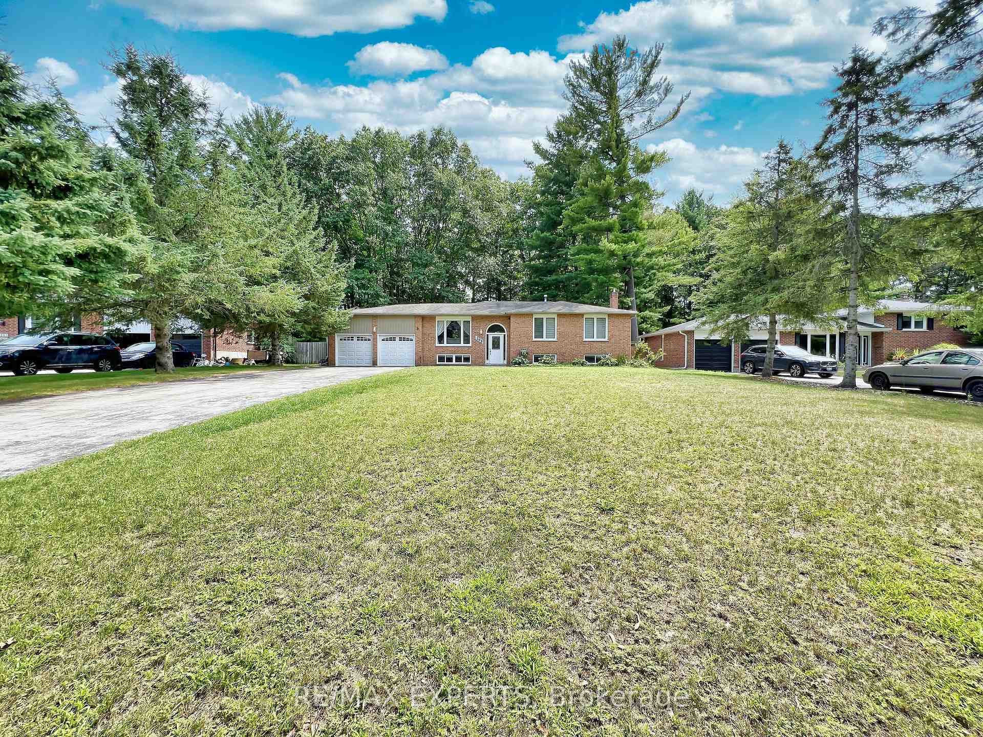 Beautifully Renovated Raised Bungalow on a Picturesque Country-Sized LotDiscover this tastefully updated raised bungalow, nestled on a stunning lot surrounded by mature trees and lush gardens. Designed with family living in mind, this home features an elegant open-concept layout, stylish finishes, and abundant natural light.The gourmet kitchen boasts upgraded cabinetry, sleek quartz countertops, stainless steel appliances, and a functional center islandperfect for cooking and entertaining. Spacious, sunlit bedrooms offer large windows that bring the beauty of the outdoors inside.The bright, fully finished basement offers incredible potential with three additional bedrooms, a separate kitchen, its own laundry, a cozy gas fireplace, and a convenient walk-up to the garageideal for extended family or rental income.Located in a sought-after neighborhood, this home is just minutes from parks, top-rated schools, and shopping. A rare gem offering space, style, and investment potential!