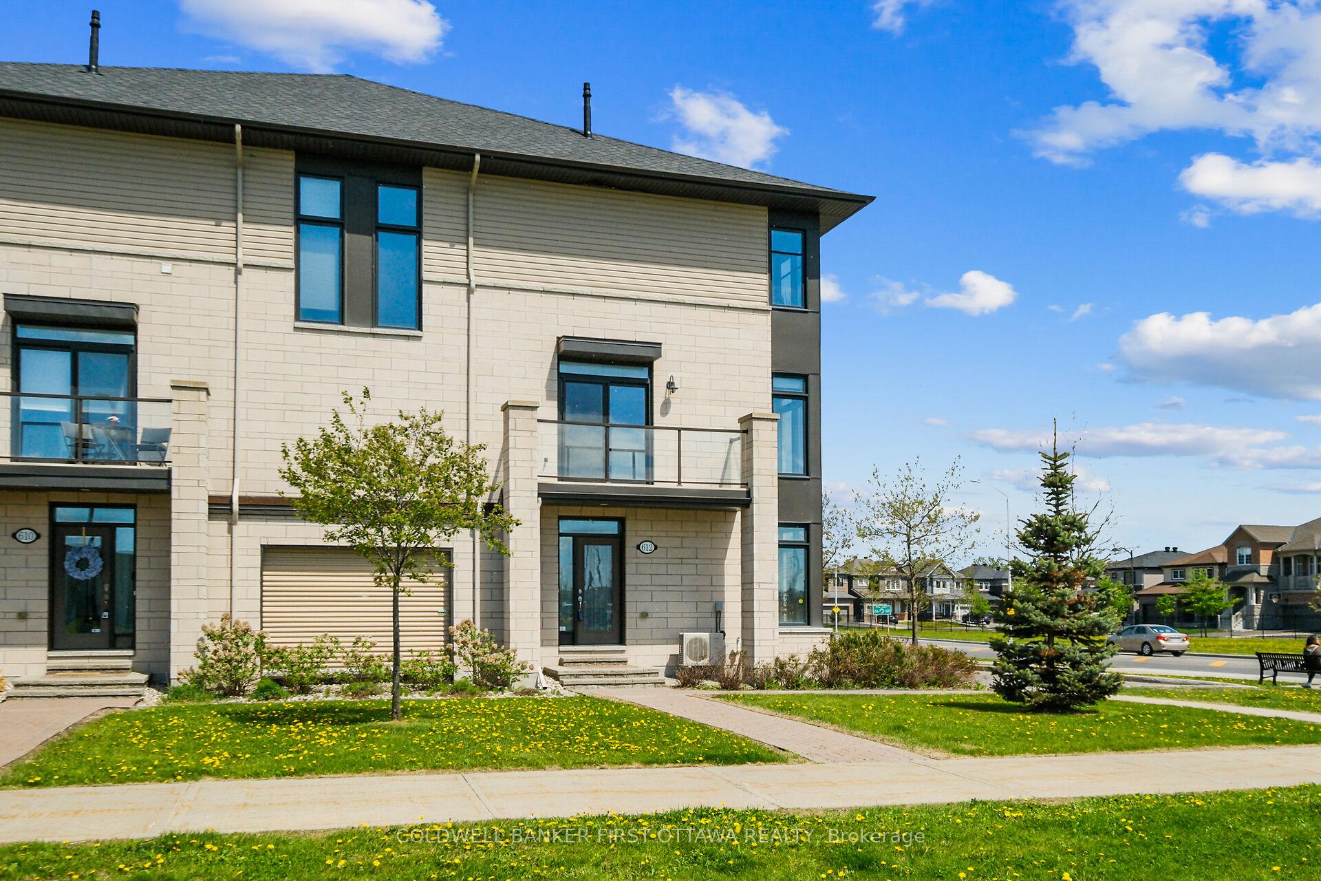 Elegant Tamarack-Built Cardiff Gallery Townhome in Central Orleans. Experience luxury living in this beautiful 1,514 sq. ft. modern corner townhome located in a prime central Orleans location. This stunning property boasts abundant natural light streaming through windows on multiple sides, complemented by soaring 9-foot ceilings throughout. The premium hardwood flooring, stylish pot lights, and upgraded light fixtures enhance the contemporary aesthetic of this exceptional home. The thoughtfully designed three-level layout begins with a main floor featuring a convenient garage entrance, versatile den, and powder room. Ascending to the second level reveals an impressive open-concept kitchen, dining, and living area. The kitchen is a chef's delight with its spacious pantry, sleek stainless-steel appliances, and luxurious upgraded quartz countertops. Step outside to the southwest-facing balcony, complete with a gas BBQ hook perfect for entertaining on warm summer evenings. The third level houses the elegant master bedroom with its upgraded ensuite and generous walk-in closet, alongside a second bedroom, full bathroom, and conveniently located laundry room. The property's ideal location puts you mere steps from shopping amenities, close to recreation centers, with OC Transpo express bus service to downtown available directly in front of the building.