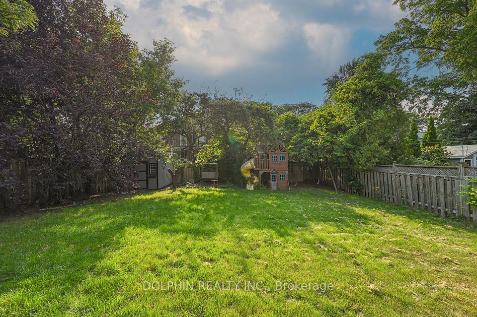 Backyard with swing and playhouse