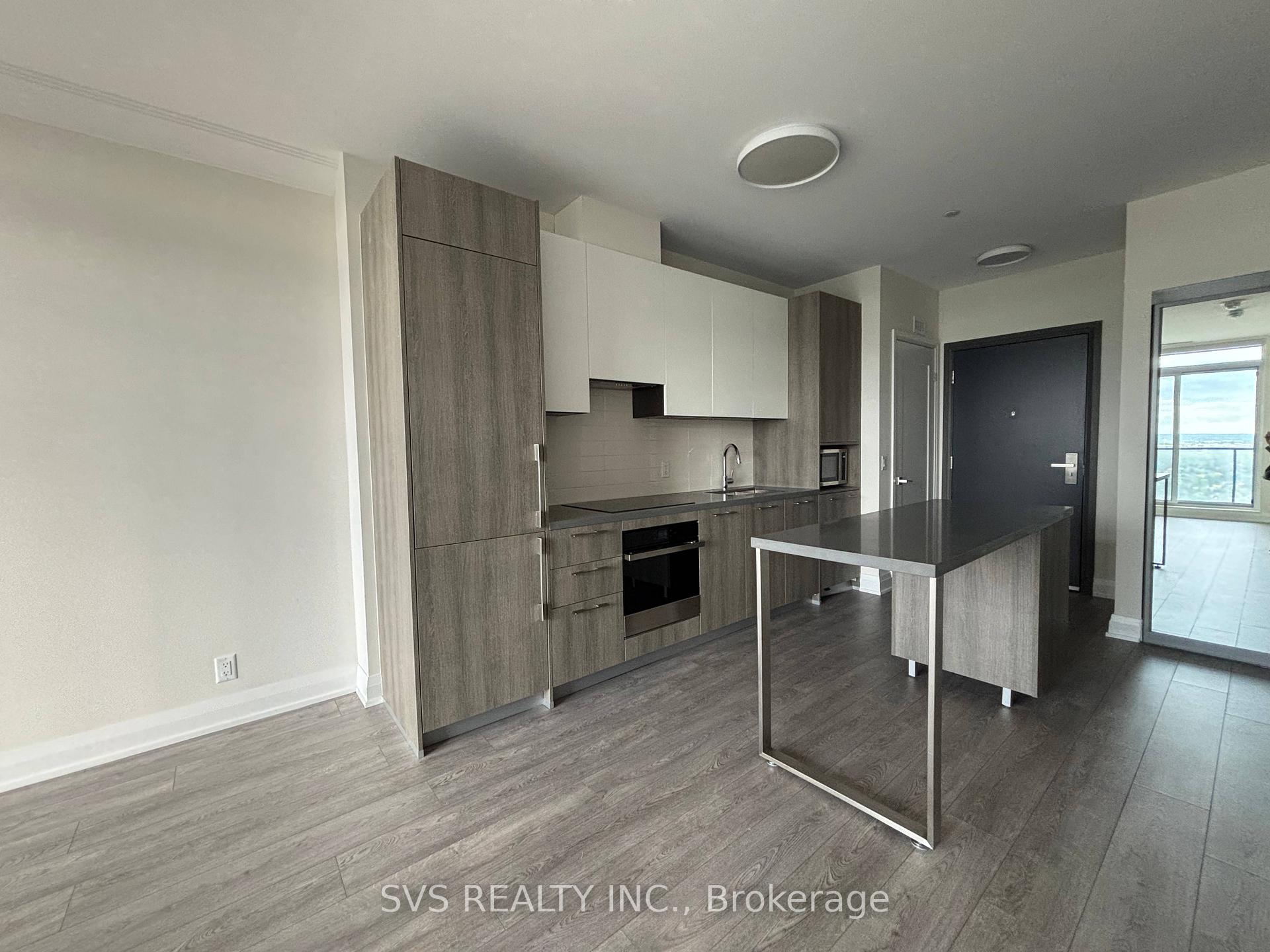8 Water Walk Drive 4609 Markham, Ontario Experience elevated urban living in this immaculate 1+1 bedroom suite at the prestigious Riverview Master Tower, ideally situated at Warden Avenue & Highway 7 in the vibrant heart of Markham. Boasting 625 sq ft of expertly designed space, this high-floor unit offers breathtaking unobstructed views from a private open balcony. The intelligently crafted layout features 9-foot ceilings, a generously sized bedroom, and a fully enclosed den with a door ideal as a home office or guest room. The modern kitchen is appointed with premium built-in appliances, quartz countertops, an undermount double sink, and a sleek quartz backsplash perfect for the contemporary lifestyle. Enjoy the convenience of FOB or app-based smart access, as well as one parking space and one locker included. Located steps from No Frills, Whole Foods, LCBO, fine dining, and Cineplex VIP Cinema, with easy access to GO Transit, Highways 404 & 407, this location truly combines luxury, convenience, and connectivity.