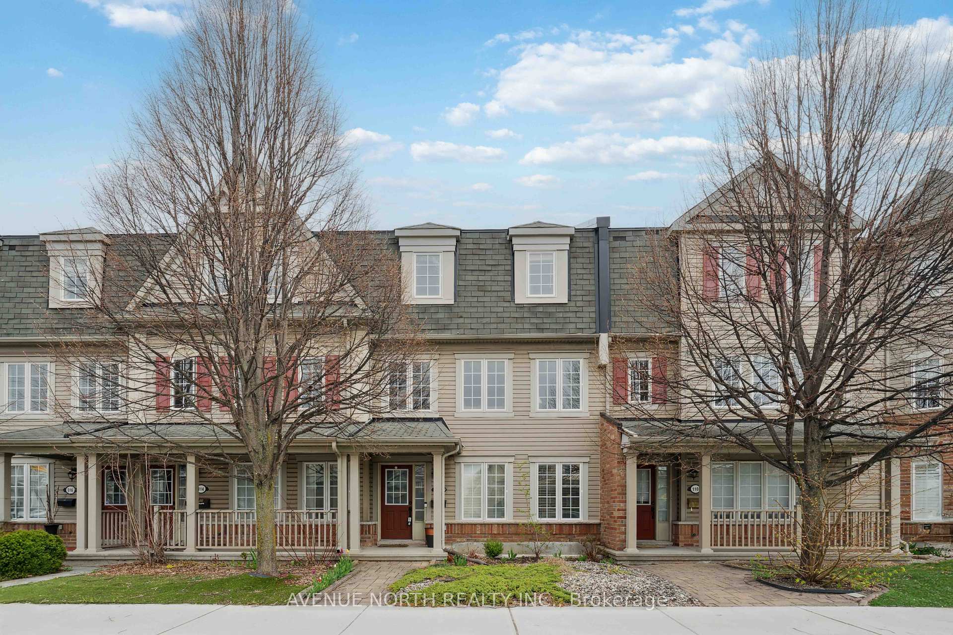 Welcome to 112 Huntmar Drive - a beautifully maintained, 3-storey freehold townhome in the heart of Stittsville. This 2-bedroom plus den, 3-bathroom urban home offers a perfect blend of comfort, style, and convenience. The professionally landscaped front yard welcomes you into a bright main-floor den, perfect for a guest room with its generous size and large window. Upstairs, enjoy an open-concept living and dining area flooded with natural light and hardwood floors. The thoughtfully designed kitchen boasts a large island with seating and premium fixtures. Step directly onto the spacious balcony, perfect for entertaining friends on warm summer nights or enjoying a drink before heading to the nearby Canadian Tire Centre for a game or concert. The top floor offers a primary retreat with an en-suite and walk-in closet, a second bedroom, and a full main bath. Also enjoy a true double-car garage (no shoveling required!) and a laundry room with built-in cabinetry. Located just steps from parks, nature trails, groceries, public transit, the CTC, and Tanger Outlets, with quick access to Highway 417, this home offers the ideal low-maintenance lifestyle in a vibrant, well-connected community. Book your private showing today and settle in just in time for summer!