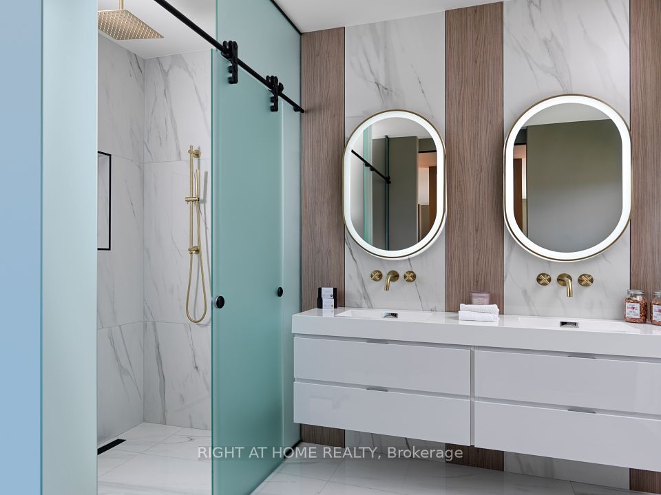 Primary ensuite with LED mirrors and double sinks