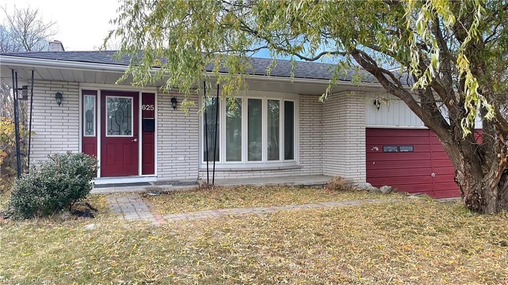 Ranch-style home with a garage and a front yard