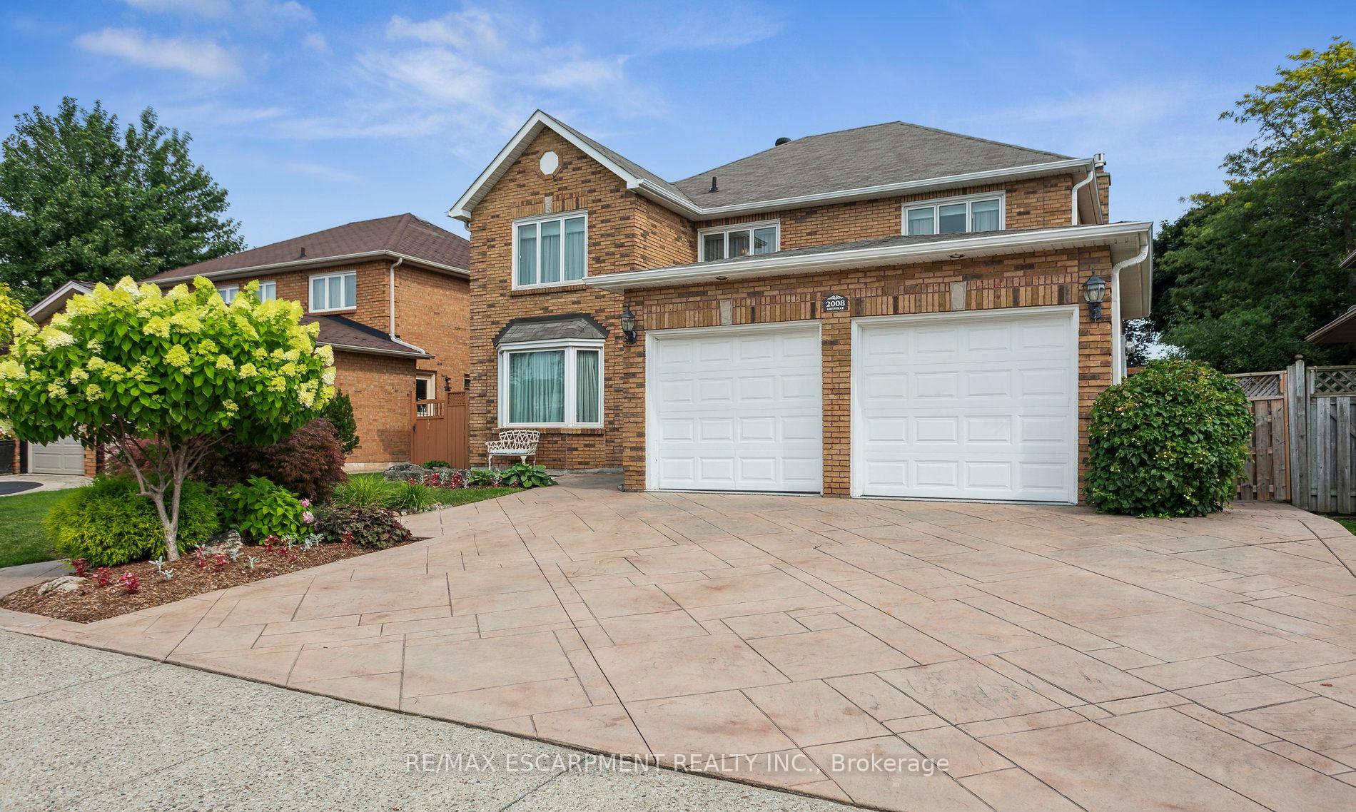 Welcome to your next chapter in this beautifully maintained 4-bedroom, 3.5-bath detached home, offering over 3,000 sq ft (above-grade) in Oakville's highly sought-after Wedgewood Creek community. Lovingly cared for by its original owner and freshly painted throughout, this home is the perfect blend of timeless design and modern comfort ideal for growing families. Located in the prestigious Iroquois Ridge High School district, this home sits on a quiet, family-friendly street just steps from parks, trails, a recreation centre, library, and shopping. From the moment you arrive, the triple-wide stamped concrete driveway and backyard patios, and the lovely landscaped perennial garden with a tranquil pond set the tone for whats to come. Step inside to a welcoming centre-hall floor plan with a grand two-storey foyer, complete with a skylight and coffered ceiling lighting that floods the space with natural light. The main floor offers spacious principal rooms, including formal living and dining rooms, a cozy family room with a gas fireplace, and a private main-floor den perfect for your home office or study. The heart of the home is the oversized kitchen and breakfast area, open to the family room and overlooking the backyard ideal for both everyday living and hosting friends and family. Upstairs, retreat to a generously sized primary suite featuring a large 8 x 11 walk-in closet and a luxurious 5-piece ensuite. Three additional well-appointed bedrooms, each with large closets, provide comfort and space for everyone. The partially finished basement offers even more room to grow, with a 4-piece bath, a small kitchenette, and endless possibilities for recreation, in-law accommodations, or additional living space. In total, this home offers over 4,700 sq ft of living space. Additional highlights include recent upgrades such as freshly painted, hardwood flooring, steam cleaned carpets, Magic windows, newer soffits & fascia, Leaf Filter Gutter Guards for low-maintenance living.