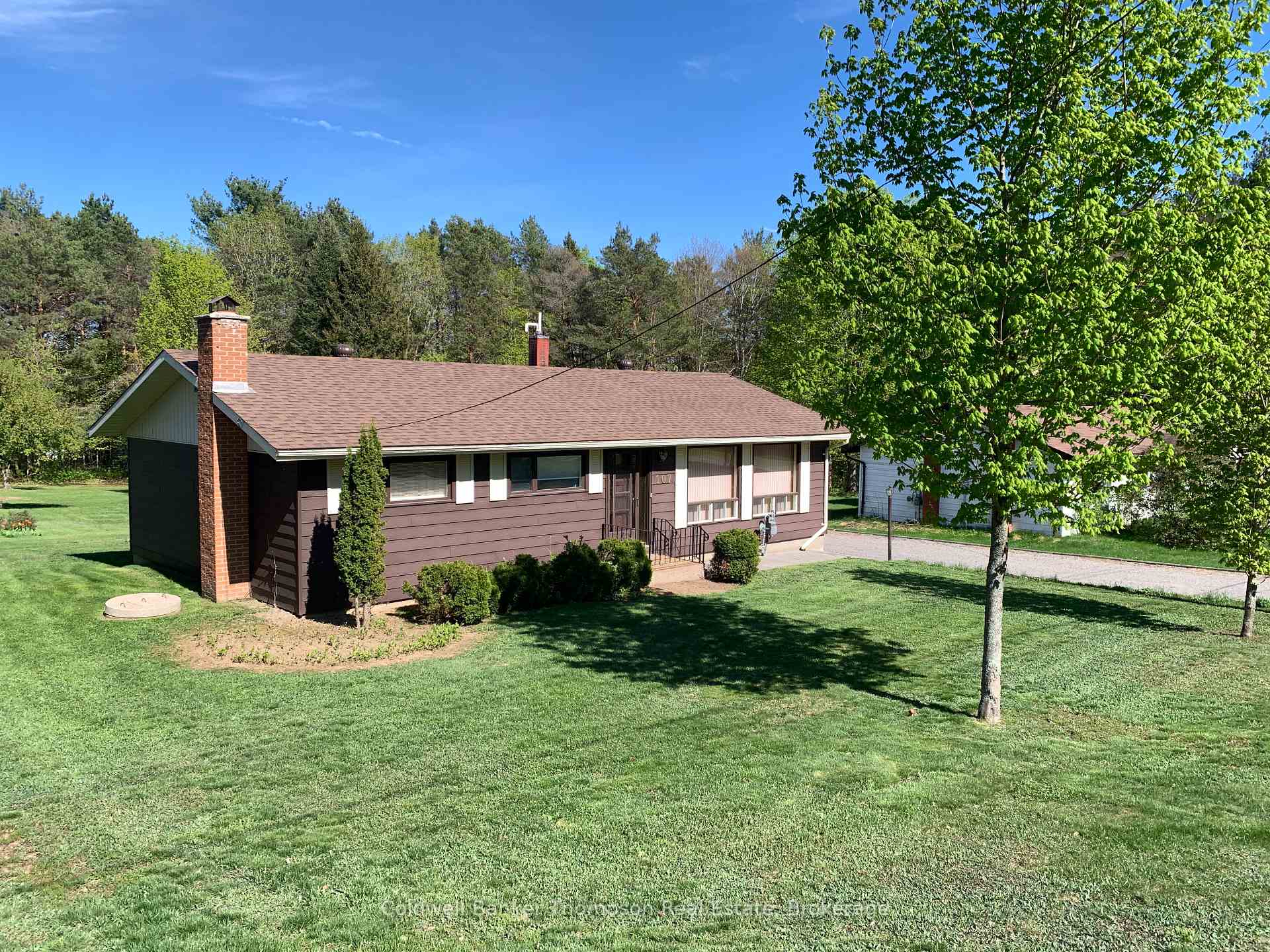 Village of Sundridge bungalow on 1 acre of land.  This home has space for the whole family.  Three bedrooms on the main floor and a fourth in the basement.  Main floor has an renovated kitchen, dining area just off the kitchen and open to the large living room.  There is a 4 piece bathroom on the main floor.  The basement has a large rec room with fireplace, 2 storage rooms and laundry room.  The sunroom is large with a great view of the back yard and exit to interlocking patio.  There are two storage sheds on the property.  With an acre of land you have plenty of room to expand.  Domestic water is supplied from a drilled well.  This home is connected to the municipal sewer system. High speed fibre is available at the road.  Updates to the home include: roof 2023, furnace and hot water tank 2019.  Appliances are included to get you started!