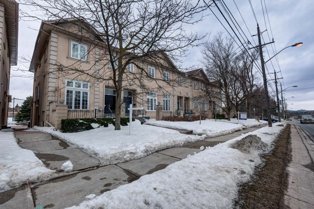 Potential Income Property W' Rare Separate Entrance - Meticulously maintained home in this rare 3+1 bedroom executive corner-unit townhome at 'Villa Hermosa on Bayview W' Separate Entrance. Spanning approximately 2,800sq. ft. LivSp, this home features soaring 13-ft ceilings with elegant crown molding on the main floor. The open-concept layout includes a functional family and dining room and a walkout to a spacious balcony equipped with a gas BBQ hookup. The upper level boasts three generously sized bedrooms, including a primary suite with a walk-in closet and 5-piece ensuite. The lower level offers convenience with a separate entrance into a mudroom, laundry, and direct access to the garage. A finished basement with 13-ft ceilings adds a large rec room, additional room and a full bathroom, perfect for entertaining or additional living space. Ideally located near all amenities and public transit, this home blends sophistication, comfort, and convenience seamlessly.