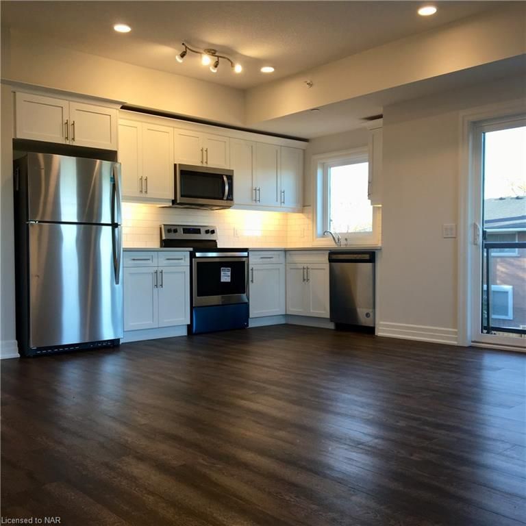 Kitchen/Dinette. Patio Doors to Wrap-Around Balcony. 