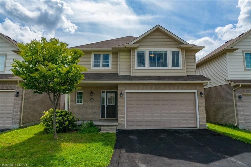 960 Bitterbush Crescent 30 London North, Ontario Welcome to Oakridge Meadows! This spacious home features an open-concept eat-in kitchen with a breakfast bar, a bright great room with 9' ceilings and hardwood floors and a private backyard with a large sundeck. It offers 3 bedrooms, 3 full bathrooms, and convenient second floor laundry. The finished lower level has high ceilings, a full bath, and slider doors to the fenced yard. Just 6 minutes to Western University, University Hospital, and close to Costco. Double garage, double-wide driveway. $50/month covers street snow removal.