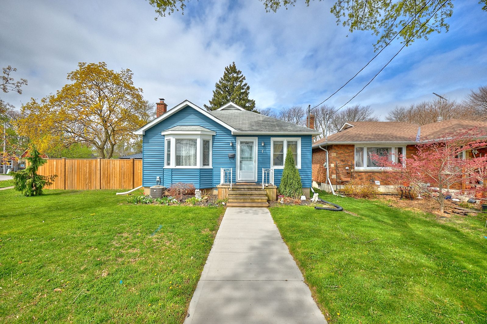 1 Thorndale Avenue St. Catharines, Ontario Charming & Updated 4-Bedroom Bungalow in Central St. Catharines. Don't miss this beautifully updated 4-bedroom, 2-bathroom bungalow, ideally situated in central St. Catharines just minutes from the QEW, shopping, and schools. Designed with an inviting open-concept layout, this home offers the perfect blend of comfort and entertainment space, making it ideal for family gatherings and hosting friends. Step inside to discover a modernized kitchen (2018) that seamlessly flows into the living and dining areas, creating a warm and welcoming atmosphere. Cozy up in the family room by the gas fireplace (2022) for those cooler evenings, while the new siding (2024) enhances curb appeal and durability. Outside, enjoy a spacious, fully fenced backyard with a newly installed concrete patio, perfect for outdoor relaxation and summer barbecues. The detached garage provides additional storage and parking convenience. This home features two bedrooms on the main level and two bedrooms downstairs, offering versatile living arrangements. With a separate entrance, the lower level presents exciting in-law suite potential, complete with a generous family room, laundry room, and utility space. Don't miss out on this fantastic opportunity. Schedule your viewing today and envision yourself in this charming and well-maintained home!