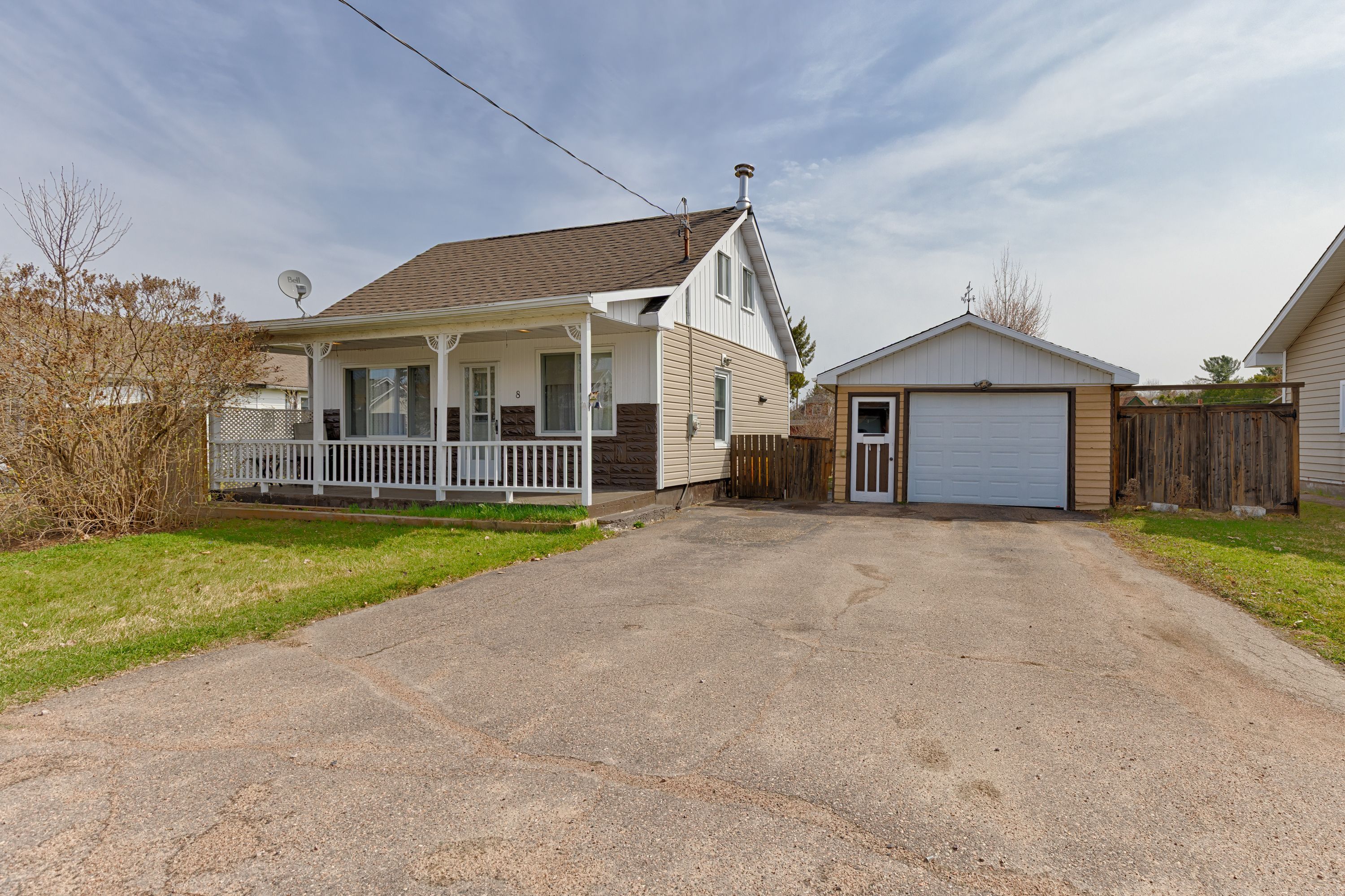8 Ethel Street Petawawa, Ontario This adorable 2+1 bedroom, 1-bath home sits on a spacious, fully fenced lot, perfect for families and pet owners alike. Move-in ready and full of charm, this home features a cozy front porch ideal for unwinding after a long day. The detached garage offers ample space for a work shop, storage or recreational toys, and the backyard provides safety and peace of mind for kids and pets. Located in the heart of town just steps to schools, shopping, parks, and minutes to Garrison Petawawa. Thoughtfully updated throughout, recent improvements include: an energy-efficient natural gas furnace (2016), central air conditioning (2020), hot water tank, electrical panel. Roof shingles on house were replaced in 2013. 48 Hr irrevocable required on all offer