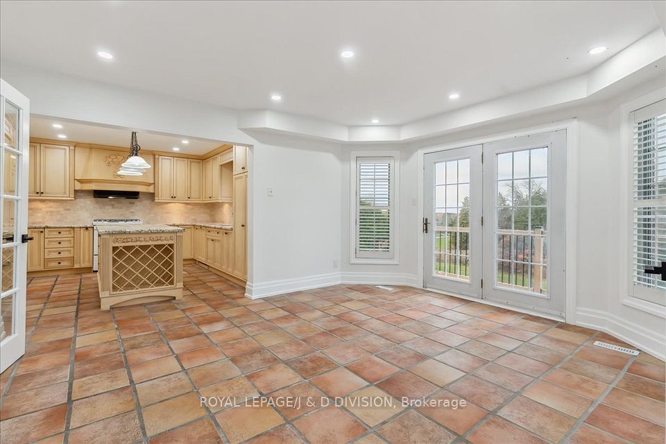 Kitchen open to breakfast area & walk-out to deck