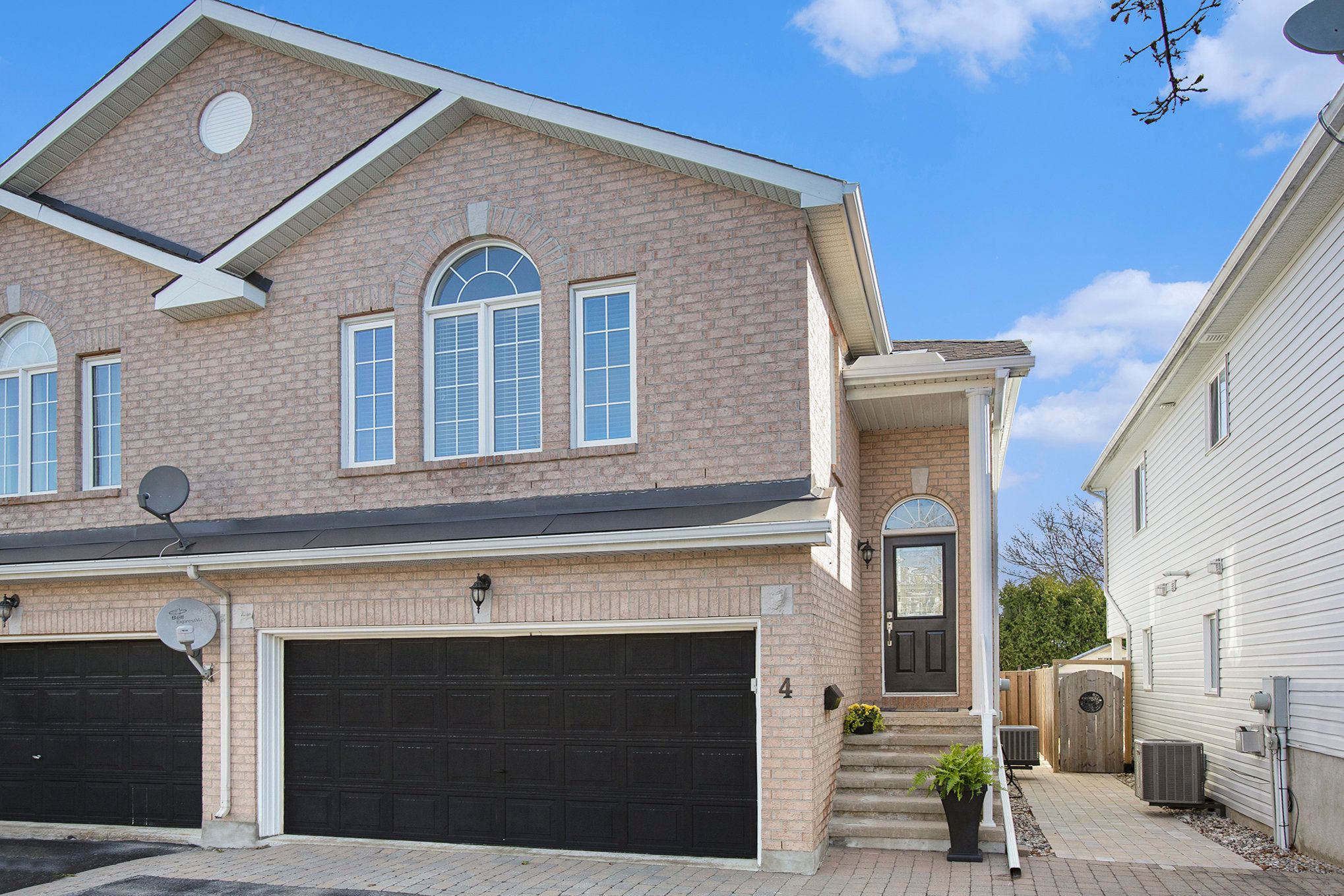 4 Castle Glen Crescent Kanata, Ontario Welcome to 4 Castle Glen Drive! This standout Windsor 2 model by Olympia Homes was originally built as the model home for Phase 2, and it shows! Larger than neighbouring properties, it offers thoughtful upgrades and a flexible hi-ranch layout perfect for families, multi-generational living, or those needing an in-law or teen suite. The sun-soaked main level features soaring cathedral ceilings, rich dark hardwood floors, and west- and south-facing windows that flood the space with natural light. The open-concept kitchen, living, and dining areas create an ideal flow for entertaining. Two generous bedrooms, including a primary suite with walk-in closet, soaker tub, and separate shower, plus another full bath, complete the level. The bright walkout lower level includes a spacious family room with a gas fireplace, a third bedroom, a full bath, a large utility/storage room, and interior access to the double garage. Enjoy outdoor living with a covered, no-maintenance deck and a fully fenced yard. Located steps from schools, parks, shopping, transit, and the Trans Canada Trail - this one checks all the boxes!