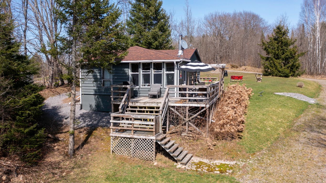 3 Keele Road Whitestone, Ontario AFFORDABLE TURNKEY WATERFRONT COTTAGE! PRIVATE 2+ ACRE RETREAT! 450 ft SHORELINE! 4-SEASON Charming & fully furnished cottage is move-in ready, Just bring your suitcase & start enjoying Cottage Life! Ideally Insulated & heated for year round enjoyment, 2 spacious bedrooms + Bright sunroom (with pull out couch for extra guests - sleeps 6), Open-concept kitchen/living/dining area with cozy pine interior, New vinyl laminate flooring (Traffic Master durable & low-maintenance), Drilled well, New septic system ('17), New shingles ('20), Rough-in for washer & dryer, Expansive wrap around sundeck for extended outdoor enjoyment with views of your private acreage & waterfront, Gentle slope to the waters edge offers easy access for all ages, Ideally set back with plenty of level land, Room to roam & play for families & kids, (Imagine badminton, volleyball, soccer, golf practice), Convenient Natural boat launch, 2 new dock systems, Excellent swimming, fishing & boating right from your shoreline, Parking for your RV, trailer, or boat (RV pad in place), Large storage shed for toys, tools & gear, Nature & Adventure Lovers' Dream: Explore 40 miles of interconnected waterways on the Deer & Magnetawan Rivers, Great fishing: Smallmouth Bass, Pike, Walleye, & more, Easy access to ATV/snowmobile trails & Crown Land for hunting, Soothing sounds of birds & wildlife all around. Convenient Location: Only 25 mins to Parry Sound: shopping, restaurants, Trestle Brewery, Legend Distillery, Stockey Entertainment Centre, Georgian Bay access, Just 15 mins to Dunchurch for groceries, LCBO, gas, nursing station, Whitestone Library with daily activities for the kids. TURNKEY & READY TO ENJOY! Comes fully furnished for your convenience. Whether you're looking for a family retreat, rental investment, or PEACEFUL NORTHERN GETAWAY, This Affordable Waterfront Cottage checks all the boxes!