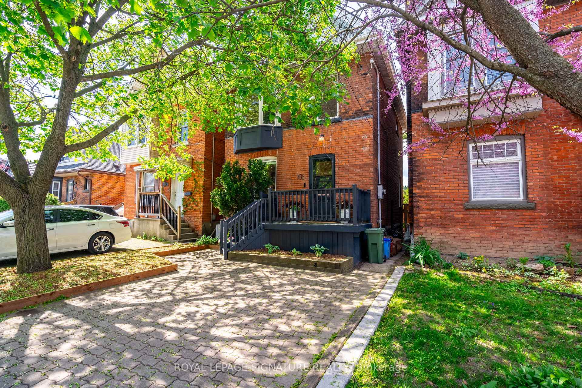 409 Herkimer Street Hamilton, Ontario Welcome to 409 Herkimer - where charm meets chill in Kirkendall West. This 4-bedroom beauty serves up modern updates and classic vibes in one of Hamilton's most loved neighbourhoods.The kitchen? A total showstopper - bright, open, previously featured in The Globe and Mail, and made for entertaining. Upstairs, you have 3 bedrooms (one's currently used as a dressing room), plus a gorgeous newly renovated bathroom. Up again and you're in your new fave zone- a cozy media room/den/teen hideaway/all-of-the-above and the 4th bedroom or home office.Want to switch it up? There are plans available to convert this 3rd level into a full out primary bedroom haven with zen like ensuite and walk in closet. Just ask for more details. Downstairs adds even more with a finished flex space, a yoga room at the moment, another bathroom, and lots of storage. The fenced backyard is perfect for kiddos, pups, and patio hangs. A convenient parking pad out front can fit 2 cars if they're on the smaller size. Just steps to Locke Street, EarlKitchener School, and an easy zip to the highway. This one's a vibe. Come see it.