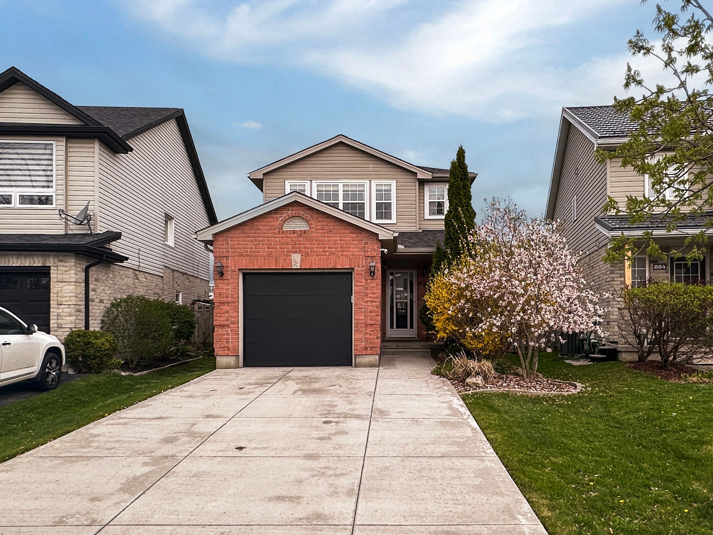 880 Marigold Street London North, Ontario Get ready to fall in love because 880 Marigold Street is the kind of home that makes you exhale the moment you walk up the driveway. You know the one, it just feels right. Nestled in the prestigious North end of London, surrounded by top-rated schools and fabulous shopping, this charming 3-bedroom, 3-bathroom detached beauty isn't just a house, it's a lifestyle. Step through the front door and you'll find space, function, and potential. The main floor offers a warm, comfortable layout perfect for growing families, busy professionals, or anyone ready to plant roots. Picture yourself pulling into this quiet, family-friendly street. The elegant red brick exterior and blooming spring tree greet you like a warm hug. Step inside and you'll find spacious principal rooms, light dancing through large windows, and a kitchen that's just begging for Sunday morning pancakes and late-night heart-to-hearts. Upstairs, three generously sized bedrooms give everyone their own space, and that primary suite? Let's just say, its giving sanctuary vibes. The furnace and AC are only 3 years young, the hot water tank is owned (and just 5 years old), and you've got parking for three, one in the garage, two on the driveway. The curb appeal is lovely, especially with that blossoming tree out front, welcoming you home like an old friend. Because at 880 Marigold Street... you're not just buying a home. You're stepping into your next chapter.