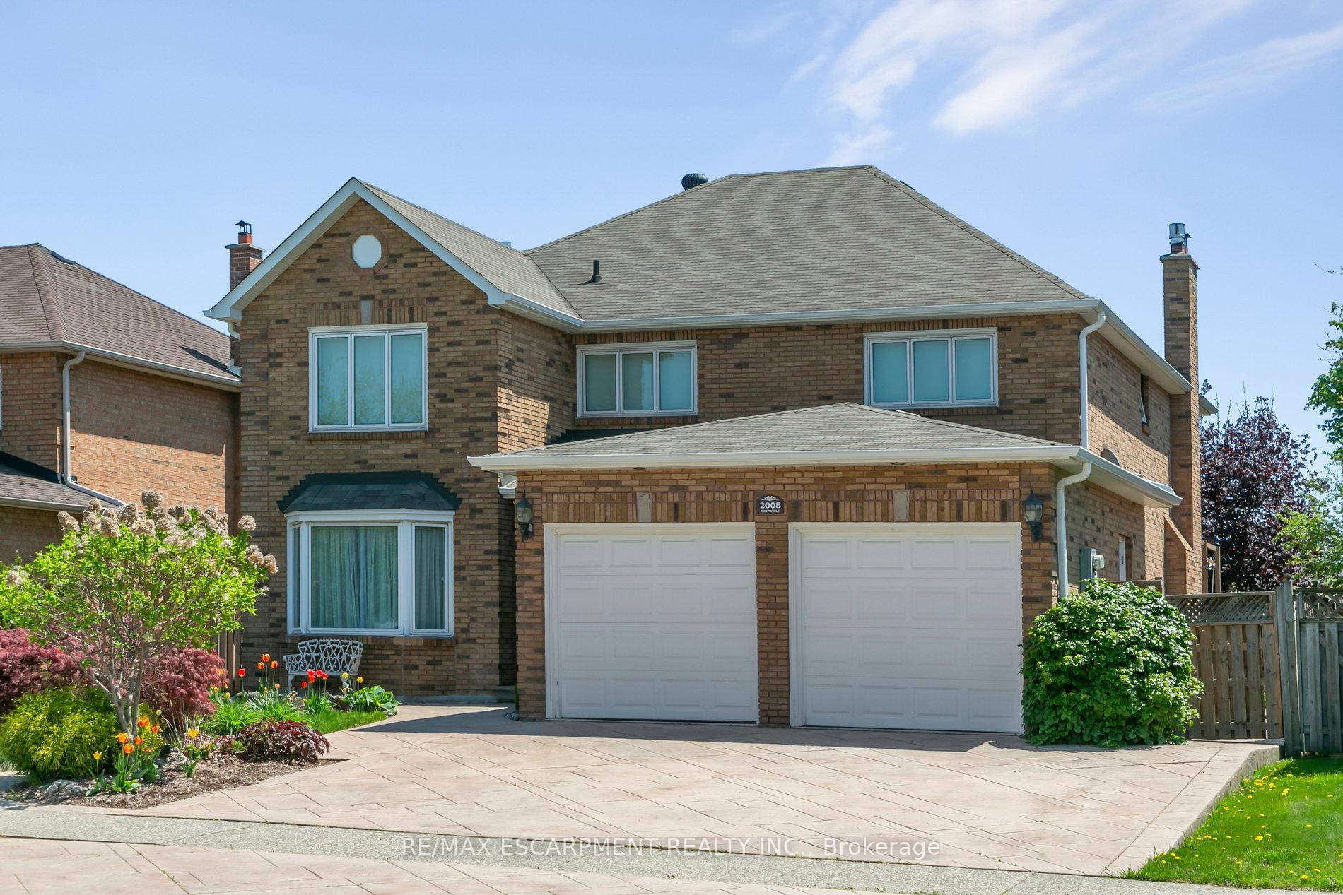 Welcome to your next chapter in this beautifully maintained 4-bedroom, 3.5-bath detached home, offering over 3,000 sq ft (above-grade) in Oakville's highly sought-after Wedgewood Creek community. Lovingly cared for by its original owner and freshly painted throughout, this home is the perfect blend of timeless design and modern comfort ideal for growing families. Located in the prestigious Iroquois Ridge High School district, this home sits on a quiet, family-friendly street just steps from parks, trails, a recreation centre, library, and shopping. From the moment you arrive, the triple-wide stamped concrete driveway and backyard patios, and the lovely landscaped perennial garden with a tranquil pond set the tone for whats to come. Step inside to a welcoming centre-hall floor plan with a grand two-storey foyer, complete with a skylight and coffered ceiling lighting that floods the space with natural light. The main floor offers spacious principal rooms, including formal living and dining rooms, a cozy family room with a gas fireplace, and a private main-floor den perfect for your home office or study. The heart of the home is the oversized kitchen and breakfast area, open to the family room and overlooking the backyard ideal for both everyday living and hosting friends and family. Upstairs, retreat to a generously sized primary suite featuring a large 8 x 11 walk-in closet and a luxurious 5-piece ensuite. Three additional well-appointed bedrooms, each with large closets, provide comfort and space for everyone. The partially finished basement offers even more room to grow, with a 4-piece bath, a small kitchenette, and endless possibilities for recreation, in-law accommodations, or additional living space. In total, this home offers over 4,700 sq ft of living space. Additional highlights include recent upgrades such as freshly painted, hardwood flooring, steam cleaned carpets, Magic windows, newer soffits & fascia, Leaf Filter Gutter Guards for low-maintenance living.