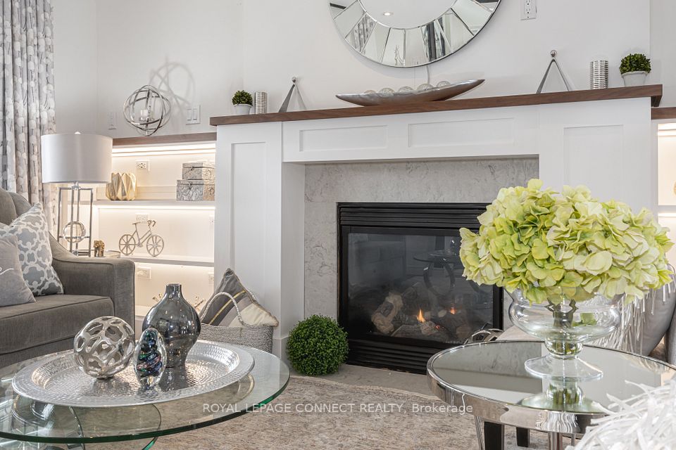 Custom fireplace w/ millwork & LED lighting.