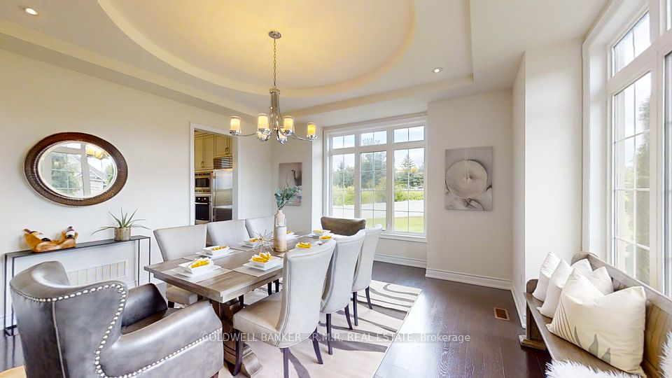 Formal Dining with Tray Ceiling & Large Windows