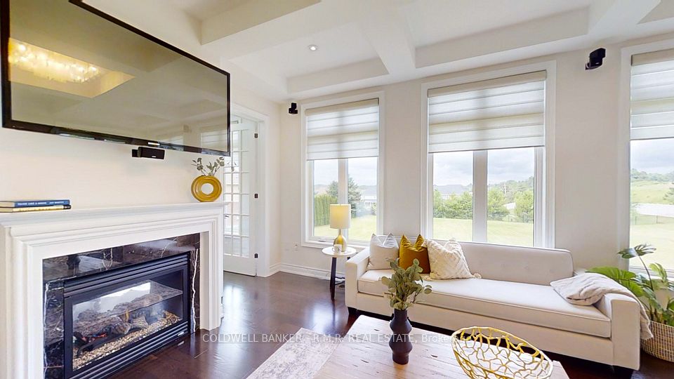 Family Room With Fireplace and Large Windows