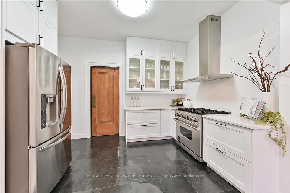 Main level kitchen with door to dining