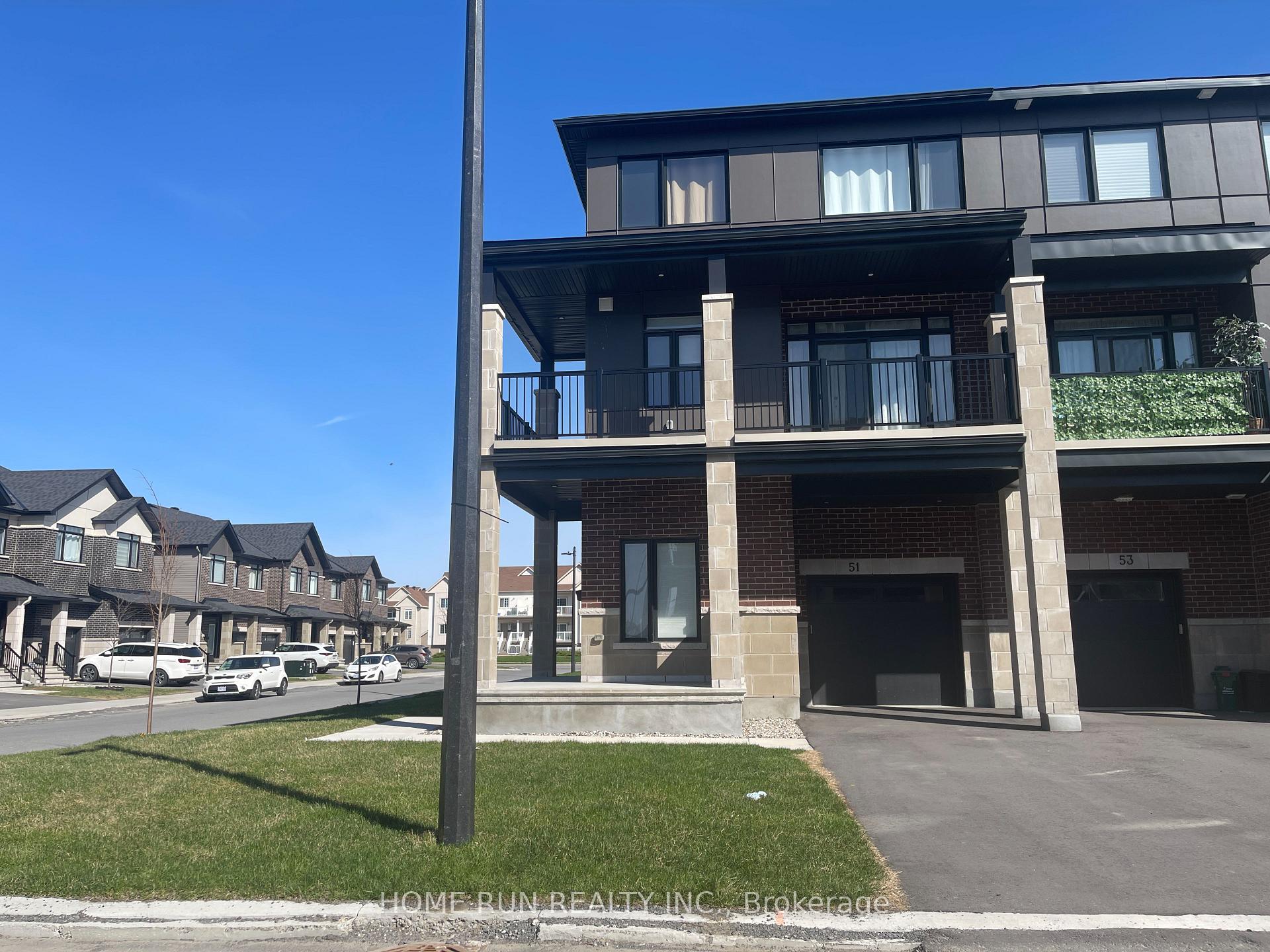 51 Arinto Place Kanata, Ontario Built in 2023, this is a beautiful 2-bedroom, 2.5-bathroom corner-unit townhouse located in the sought-after Bridlewood Trails community. The home is filled with natural light throughout the day and offers a thoughtful layout across three levels.The first floor features a welcoming foyer and a laundry room that connects directly to the garage, which is equipped with a garage door opener for added convenience.On the main floor, you'll find a spacious open-concept living area with hardwood flooring throughout. The modern kitchen is fitted with granite countertops and stainless steel appliances, flowing seamlessly into a bright dining area and a cozy living space. A stylish powder room and a large corner balcony complete this level, offering the perfect place to relax or entertain.Upstairs, the third floor includes a generous primary bedroom with its own ensuite, a second bedroom, and another full bathroom. Both bedrooms enjoy an unbeatable street view. A beautiful front lawn adds to the charm of this home and offers a delightful view, especially during the summer months.This home is perfect for a family looking for a lifestyle of comfort and convenience, situated close to shopping centres, schools, and other amenities. The property will be available for move-in on August 1st.