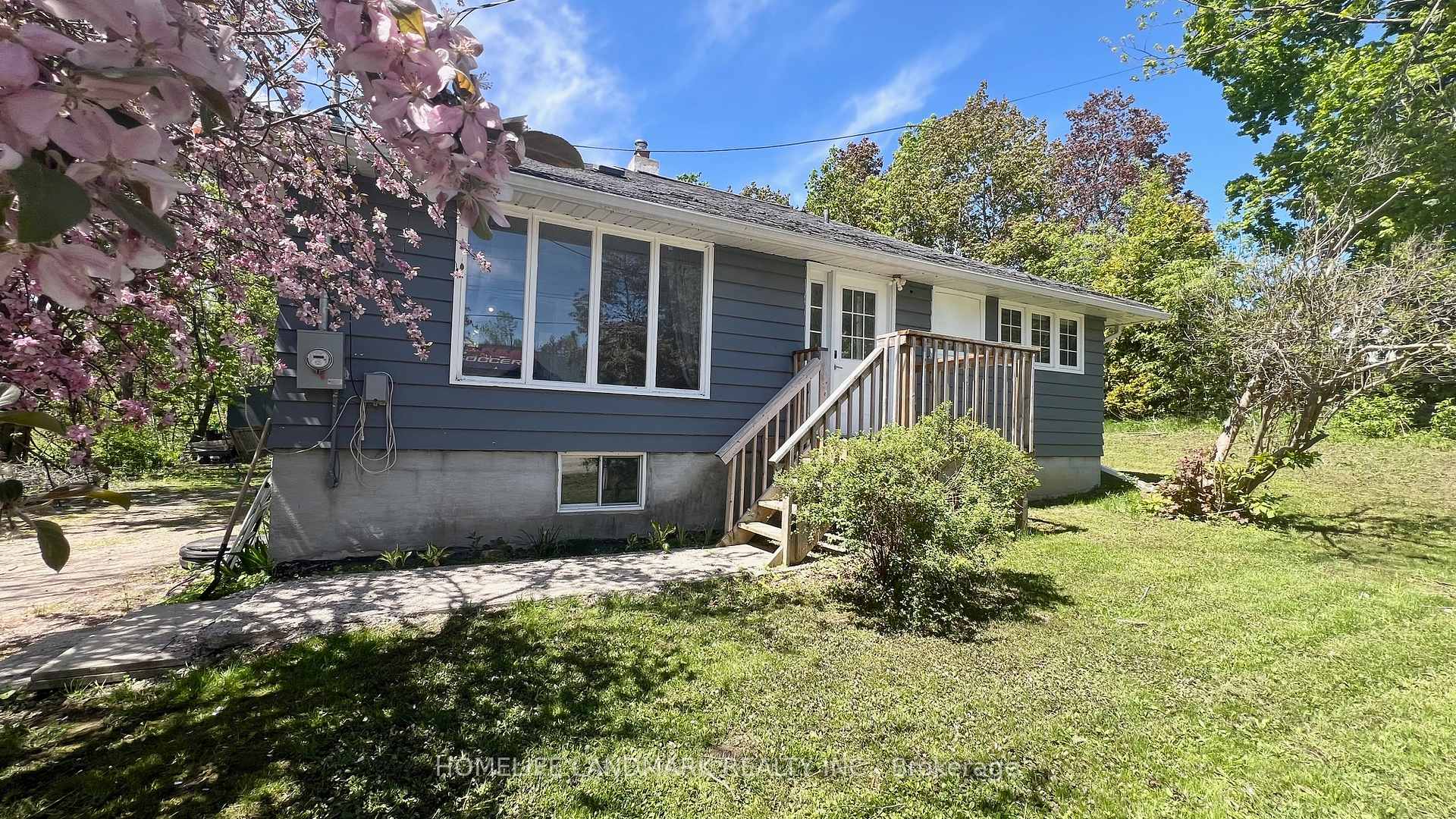 Charming Bungalow on 2.6+ Acres in Oro Station, Country living close to Lake Simcoe! Welcome to this delightful detached bungalow nestled on a generous 2.62-acre lot in peaceful Oro Station. This move-in ready home offers the perfect blend of country charm and modern convenience,  just 15 minutes from both Barrie and Orillia. Step inside to a sun-filled, spacious living room ideal for relaxing or entertaining. The bright, open-concept kitchen and dining area provide ample space for family meals and gatherings. With 3 generously sized bedrooms and a 4-piece bath, there's room for everyone. Vinyl flooring flows throughout the home, adding durability and easy maintenance. The highlight of this property is the incredible backyard oasis. Over 2 acres of mature trees and lush greenery create a peaceful, private retreat ideal for enjoying nature, gardening, or simply relaxing in your own quiet sanctuary.  Imagine waking up to the gentle sound of birdsong each morning, sipping coffee on your deck (built in 2021), stargazing at night, summer BBQ or letting the kids and pets roam free, this expansive outdoor space is a rare gem. And the location? Even better. You are just a 2-minute drive to the beach on Lake Simcoe, and close to ski resorts, golf courses, trails and local farms making this the ultimate year-round getaway. Long driveway with parking for 6 vehicles. Quick highway access for commuters and weekend getaways. This property is perfect for nature lovers, outdoor enthusiasts, or anyone seeking a peaceful lifestyle with room to breathe, or a peaceful country escape close to amenities, this Oro Station gem has it all!. Don't miss this one-of-a-kind opportunity in the heart of Oro Station!