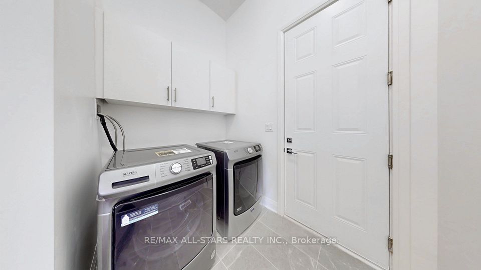 Main floor laundry room with garage access