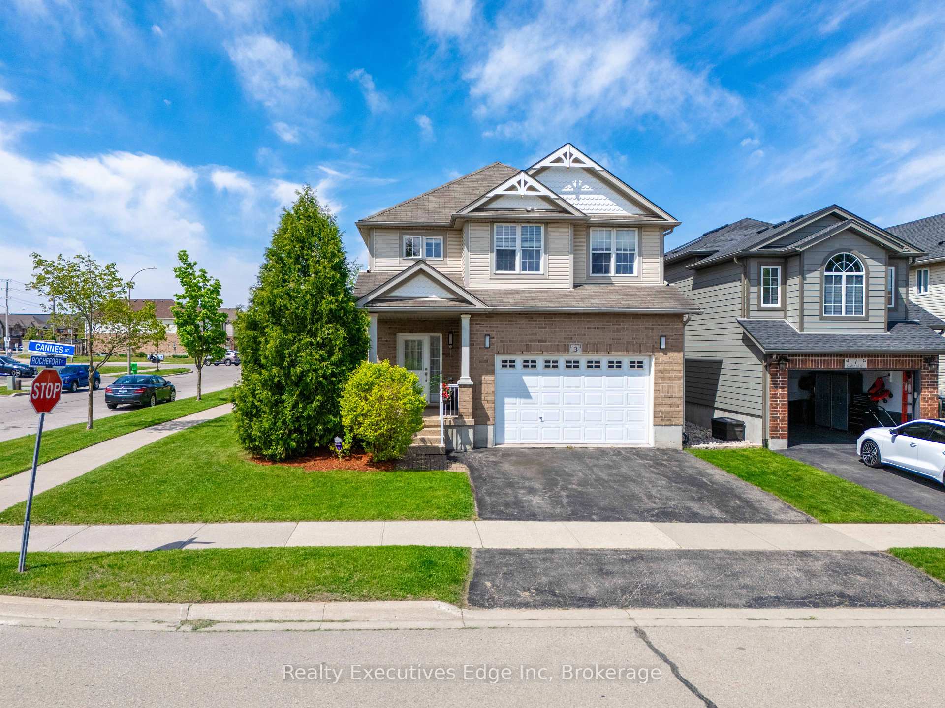 3 Cannes Street Kitchener, Ontario Welcome to a rare gem in the heart of Huron Village. This stunning builders model home is hitting the market for the first time, proudly offered by its original owner. Situated on a premium corner lot, this 3-bedroom, 4-bathroom detached home features over 2,700 sq. ft. of bright, beautifully maintained living space. The main level welcomes you with 9-foot ceilings, an open-concept design, new laminate flooring, and a fresh coat of paint that enhances the natural light throughout the space. Upstairs, you'll find a large family room with soaring 9-foot ceilings, perfect for a private lounge, home theatre, or entertainment hub. The primary bedroom includes a full ensuite, while two spacious bedrooms and a second full bathroom provide comfort and privacy for the entire family. The fully finished basement offers flexible living space, ideal for a fourth bedroom, recreation area, or home office. A dedicated laundry room comes equipped with a washer, dryer, and an extra fridge for added convenience. Outside, the landscaped backyard features a custom-built shed, and the double-car garage with two additional driveway spaces ensures ample parking. Located in an unbeatable spot just 200 m from a Catholic elementary school, 400m to the public school, and within walking distance of Longo's, Shoppers Drug Mart, banks, restaurants, and more. The areas largest recreational park is just 800 m away, with a brand-new multiplex and indoor pools currently under construction. With its spacious layout, prime location, and move-in ready condition, this home is ready for its next chapter. Schedule your private showing today.