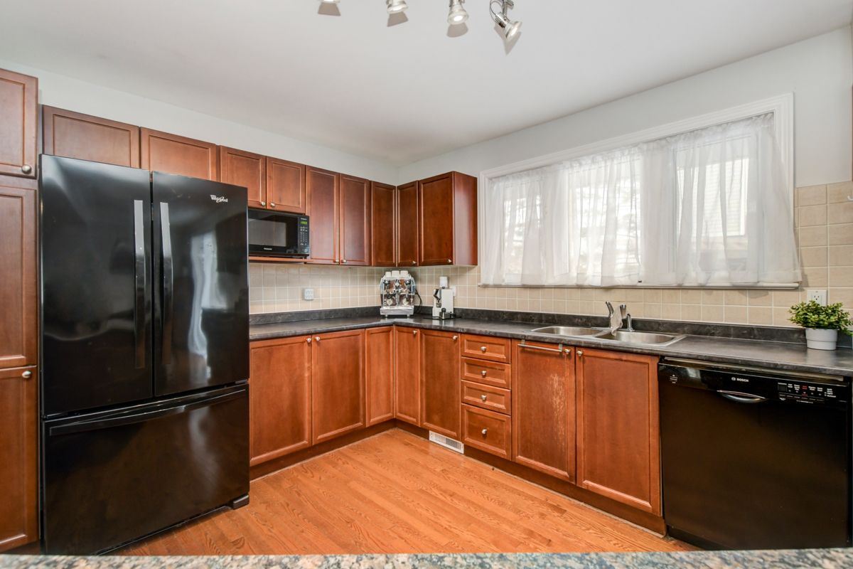 The perfect END unit townhome in Leslie Park! Lovingly maintained, the main floor is large & bright with hardwood floors & many windows! Open concept featuring an 8ft granite island with tons of storage, huge kitchen, dining area & living space with gas fireplace. Patio is all concrete & easy to maintain. Side yard is fully hedged with grass, perfect for pets & enjoying some outdoor privacy. 3 bedrooms upstairs, primary with walk-in closet & master bath w soaker tub. Fully finished basement with bathroom, lots of storage & access to your UNDERGROUND parking space! Close to amenities, transit, LRT, Queensway Carleton Hospital, excellent schools, Britannia Beach & Bruce Pit nearby. Walk along Graham Creek, which runs through a forest path leading to a park, splash pad, community garden & ice rink.. Truly a lovely neighbourhood & tight community. $422.75 /m association fee covers water, management, building insurance, maintenance and a 2ND rented, exclusive use underground parking space.