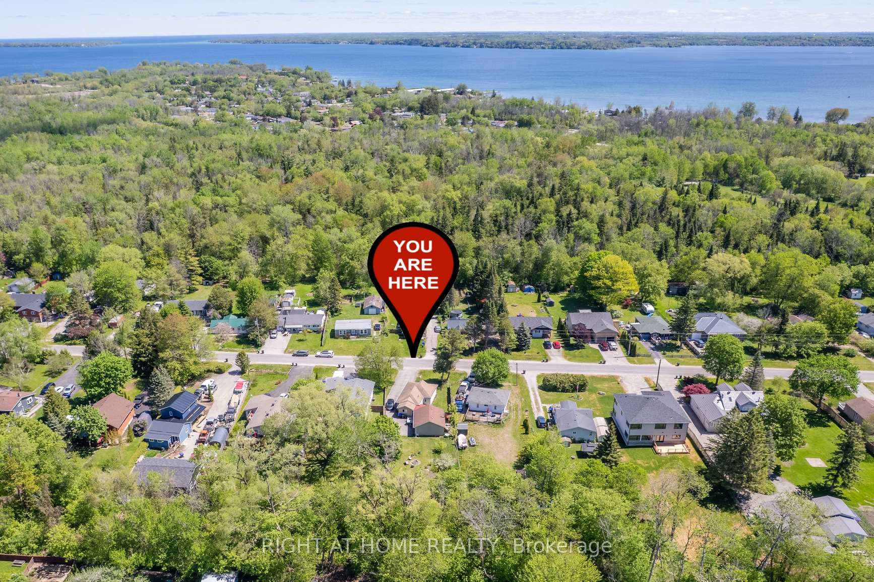 Looking for a cozy and affordable spot in a great lakeside community? This well-kept 3-bedroom bungalow might be the one, perfect for first-time buyers, investors or as a getaway cottage. Sitting on a massive 56 x 200 lot, theres tons of space and privacy to enjoy. Bright and open living/dining area and a roomy kitchen with loads of cabinet space. The attached double garage also doubles as a great workshop space. Recent updates include a new soft water treatment system and water pump. Tucked away on a quiet family-friendly street, you're just minutes from beaches, parks, golf, shopping, and a short stroll to Monto-Reno Marina and Belle Ewart Park. Plus, youre only 10 mins to Hwy 400, 15 mins to Barrie, and just under 20 mins to the South Barrie GO Station. Whether you're looking for a place to call home or a weekend escape, this one checks all the boxes: great neighbourhood, boating in the summer, snowmobiling and ice fishing in the winter and all-around good vibes.