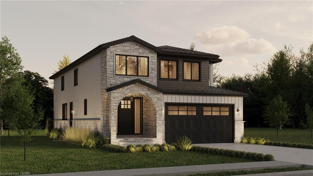 View of front facade featuring a front yard and a garage