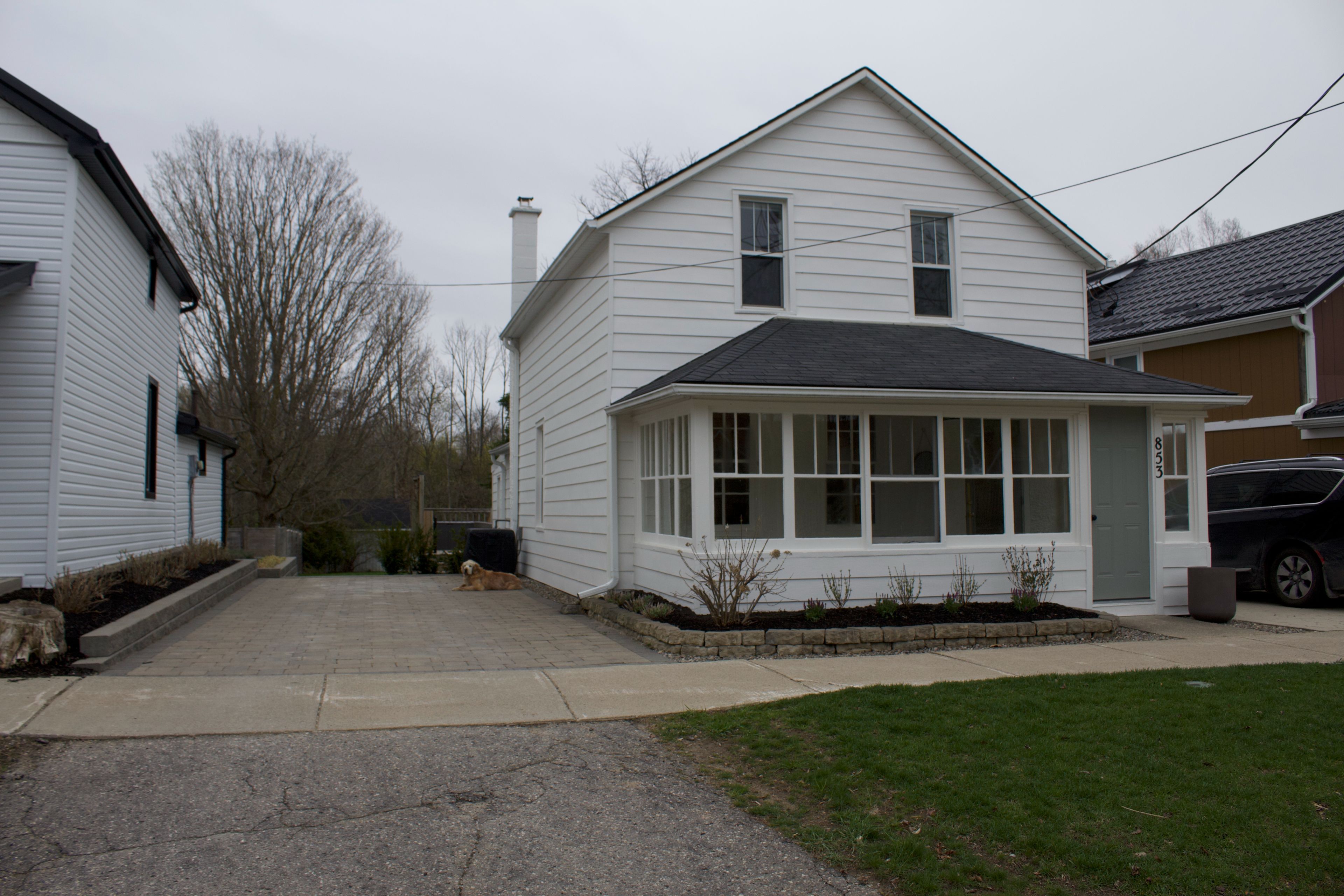 853 Olde Victoria Street N Kincardine, Ontario Beautiful downtown home with ravine location. This turn of the (20th) century home has been completely modernized and is situated on a ravine lot just two blocks from Kincardine's downtown. The interior features open plan living / dining and modern kitchen with island and quartz countertops. Main bath up has heated, tile floor. The closed in front porch has porcelain tile floor and the rest of the home has hardwood flooring. Main floor laundry off of the kitchen is combined with a two-piece bath. Gas furnace new in 2023. Patio doors from the kitchen lead to an 18' X 24' deck which overlooks the deep rear yard and treed terrain behind. Plenty of storage in the home with clever built-ins and in partial basement. Some convenient storage for winter and garden gear is right by the rear entry. In addition, near the back of the property a 9' X 10' shed with its own covered deck is located by the fire pit and overlooks the ravine.