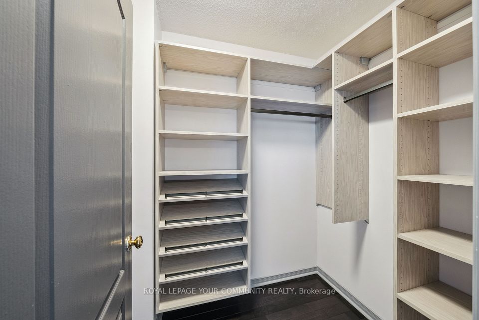 Upgraded primary closet with lots of shelving