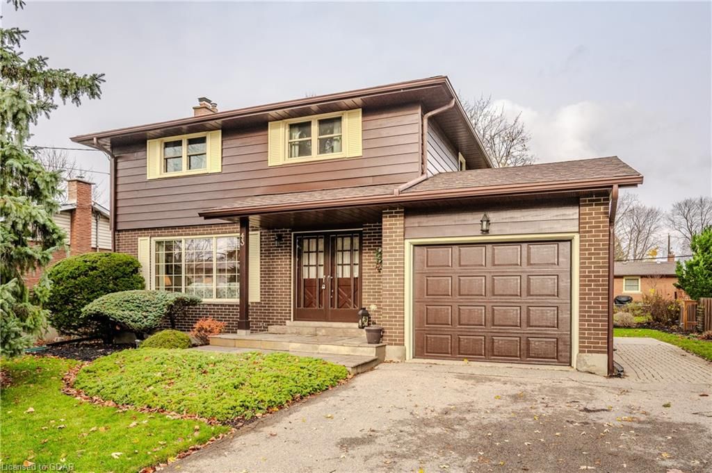 View of property with french doors and a garage