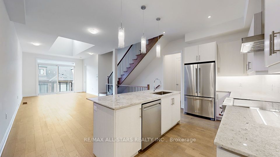 Kitchen open to dining and living areas