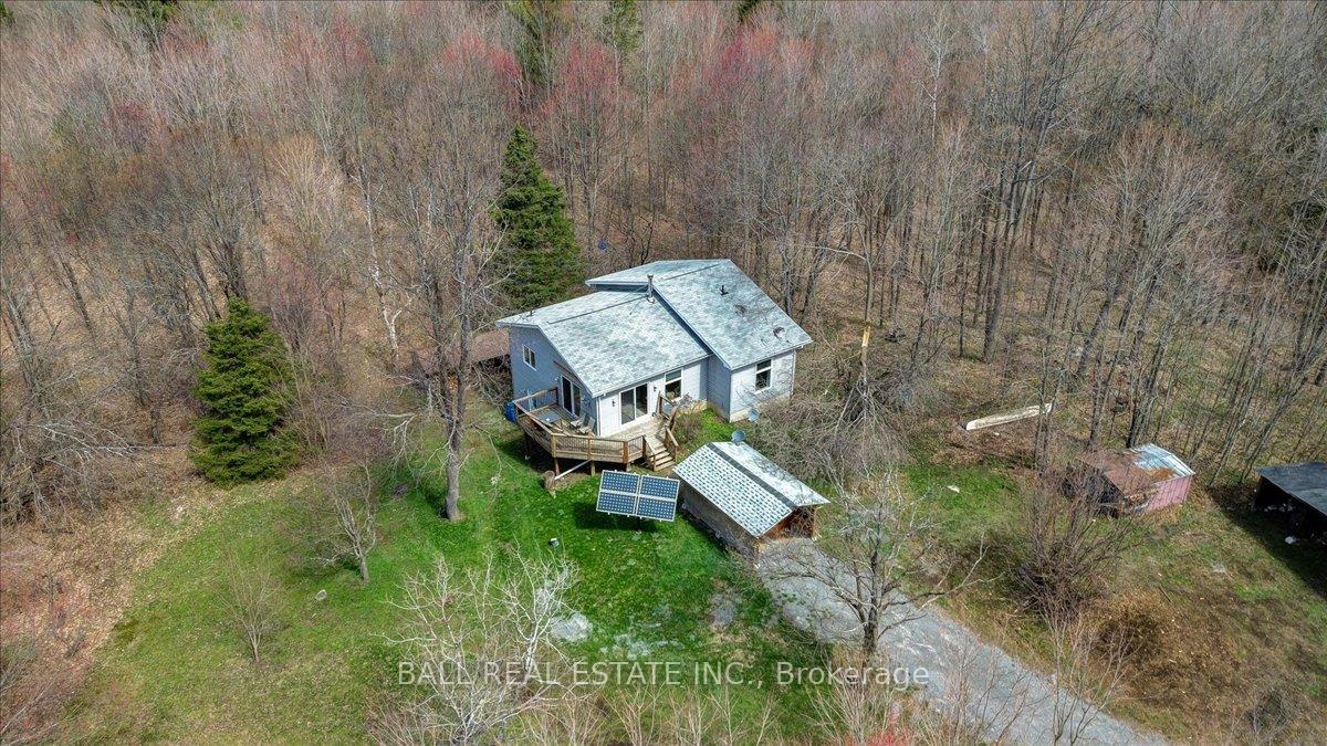 61 North Rusaw Road North Kawartha, Ontario Country living in complete privacy nestled in a beautiful 15 acre mature hardwood forest. This Valhalla home was built approximately 20 years ago, with efficiencies being a priority. The home offers 3 bedrooms, a 4 piece bath on the main floor, an open concept kitchen, dining and living area leading out to a great deck for enjoying the natural setting. The home has a full walkout basement with a woodstove in a central location which easily heats the home. The home is powered by a professionally installed solar system and is completely off grid, with a new Honda back up generator. This place never loses power! With close by trails and Chandos Lake Public Beach only 3 minutes away, this place has it all at a great price. Located just slightly off the beaten path and 2.5 hours from Toronto and Ottawa.