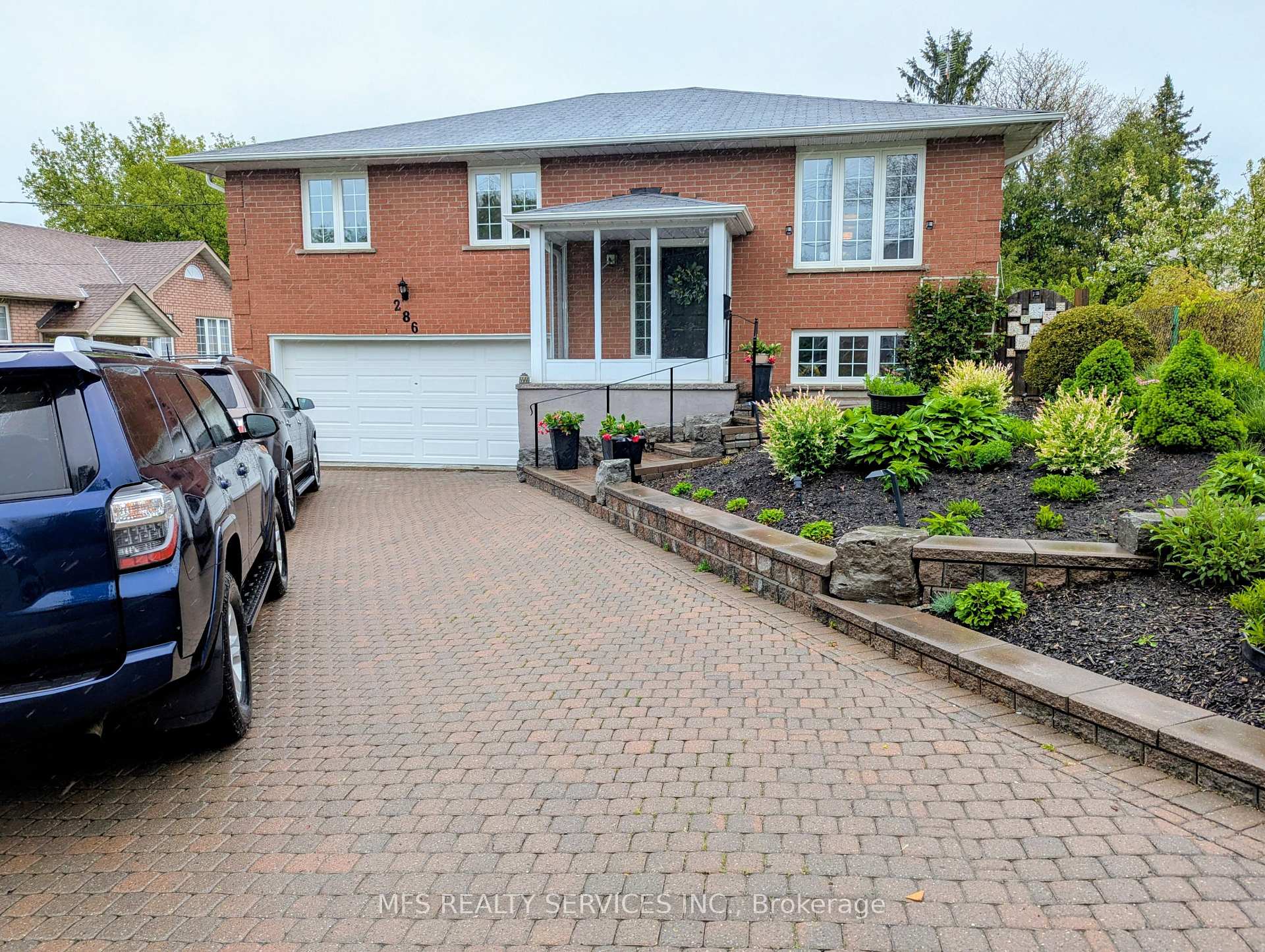 286 Seneca Avenue Oshawa, Ontario Beautifully maintained all brick custom built home of approximately 2400 square feet of living space on a quiet Oshawa street. Eat-in kitchen with oak cabinets and walk out to large new deck. Finished lower level with walk out to covered sitting patio & lovely garden with vegetable patch & new shed. Finished lower level includes bathroom, bedroom, rec room with finished space for a wood stove as well as a common room with 2nd kitchen potential. Interlock brick driveway with beautiful gardens gives this home excellent outdoor utility and appeal. Don't miss, very rare opportunity! Wont last long!