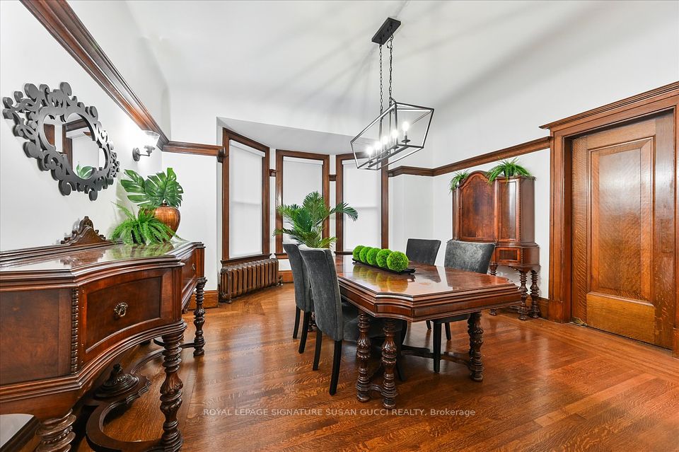 Main level grand dining room with door to kitchen