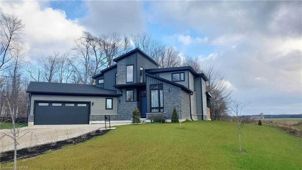 Front view of home.  Large double wideth laneway.  Double car garage.  A ton of parking.