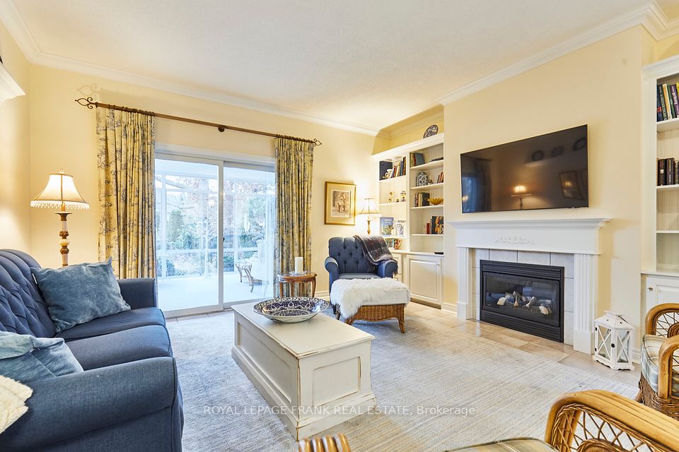 Fireplace and Built-ins & Entrance to Sunroom