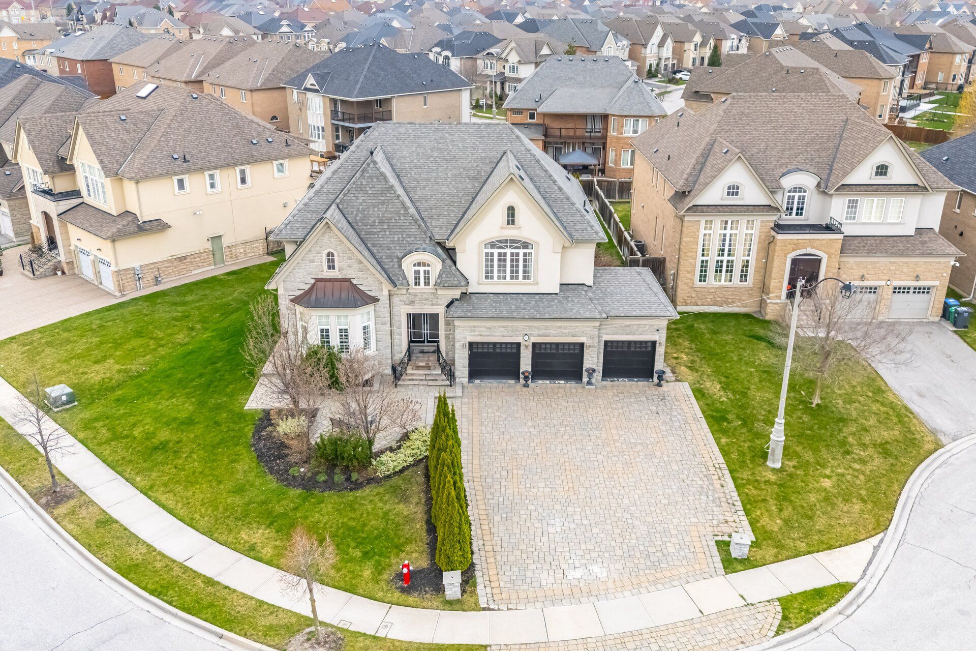 16 Adastra Place Brampton, Ontario Welcome to 16 Adastra Place! Located at the end of a quiet cul-de-sac in a family-friendly neighbourhood. This Home Is 4524 SqFt Above Ground, With 10Ft. Ceilings On the main, massive island in the kitchen with a break-bar, walk-in pantry and butlers pantry. A main floor den overlooking the backyard And ~2,200 SqFt of a Professionally Finished Basement Retreat That Will Satisfy The Most Discriminating Clients Who Want Nothing But The Best! Lower level also has a media room, exercise room, open concept recreational space with A bar, pool-table and additional room (Nanny or inlaw). Excellent Curb Appeal Boasting A 4 Car Tandem Garage And Nine Car parking on a Interlock Driveway. A Magnificent Estate On A Premium Oversized Lot!Experience Class & Elegance In This Stunning Executive Built Home, across from A Park. Upper floor features a Primary bedroom with walk-out balcony, his and her closets and ensuite,semi-ensuite bathroom in 3th and 4th bedrooms and 2nd bedroom with private ensuite. Amazing home, one of kind and shows true pride of ownership!