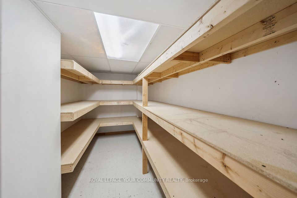 Large walk in storage closet with shelving