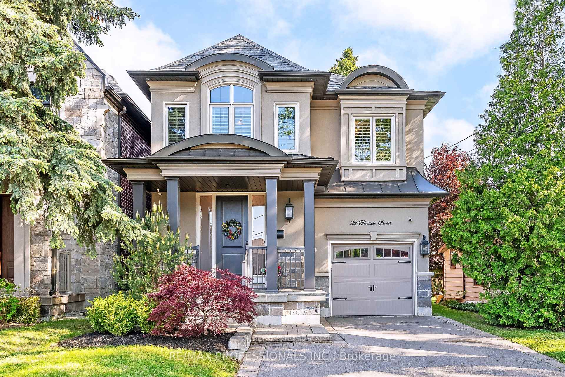 22 Brussels Street Toronto W07, Ontario Welcome to 22 Brussels Street, a custom-built 4-bedroom, 5-bath luxury home in the heart of Queensway Village. Built in 2015 and offering 3,800 sf of beautifully finished living space across 3 levels, this turnkey abode blends timeless craftsmanship with modern function and design. The main floor impresses with an open-concept layout ideal for everyday living and entertaining and includes a welcoming entryway with two double closets and a convenient powder room, soaring 9 ft ceilings, an oversized living room with a gas fireplace, crown moulding, backyard views and wire-brushed hardwood floors, a dining area defined by a statement chandelier, a dreamy chef's kitchen equipped with stainless steel appliances including a GE Monogram gas stove, a large centre island, pot lights and a subway tile backsplash, a breakfast area with a walkout to the backyard and a stylish laundry room with built-ins and direct access to the garage. Upstairs, there are four well-appointed bedrooms including a primary retreat with two walk-in closets and a luxurious 5 piece ensuite and a second bedroom with a 3 piece ensuite and a modern 4 piece main bathroom. The fully finished lower level boasts a large recreation room with a contemporary gas fireplace with fluted marble surround, pot lights and wide plank vinyl floors throughout, surround sound, a dedicated home gym, a play area, a modern 3 piece bath, utility room and an abundance of storage. A private driveway and a single-car garage with epoxy floors, integrated shelving & an EV charger provide parking for four cars. Fully, fenced-in low maintenance backyard with an entertaining-sized patio! Great location steps to Jeff Healy Park, Grand Ave Park with off leash dog park, top schools (Norseman JMS, ECI, BA & ESA) and local favourites like San Remo, Toms Dairy Freeze, Mamma Martinos & Dinos. Minutes to No Frills, Sherway Gardens, Costco, Mimico GO, TTC (1 bus to RY station) and major highways! This one checks all the boxes! OH Sun 2-4 PM!