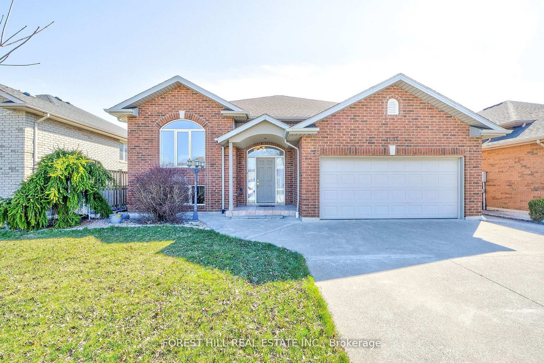 1614 Morningstar Avenue Windsor, Ontario This bright and spacious 3-bedroom, 2-bathroom brick detached home, built in 2003, has been lovingly cared for by the same family ever since. Professionally painted throughout in March 2025, it boasts a beautifully designed kitchen with solid wood cabinets and hardwood oak floors on the main level. Sliding doors lead to a fully landscaped, fenced yard with a patio perfect for barbecues and outdoor relaxation. The home features a flowing layout, ideal for entertaining.The lower level, with a separate entrance and above-grade windows, includes a cozy family room with a fireplace and an oversized, sound proofed bedroom that can easily be converted into two separate rooms.Additional features of this home include central air conditioning, central vacuum, a jacuzzi tub, and access to the garage from the foyer.Conveniently located within walking distance of Ganatchio Trail and St. Joseph High School, and just a short drive to the E.C. Row Expressway, Windsor Regional Hospital, Windsor Family Community Centre, Food Basics, Metro, Forest Glade Public School, the NextStar Energy battery plant, the Premium Outlet Mall, and many other amenities.